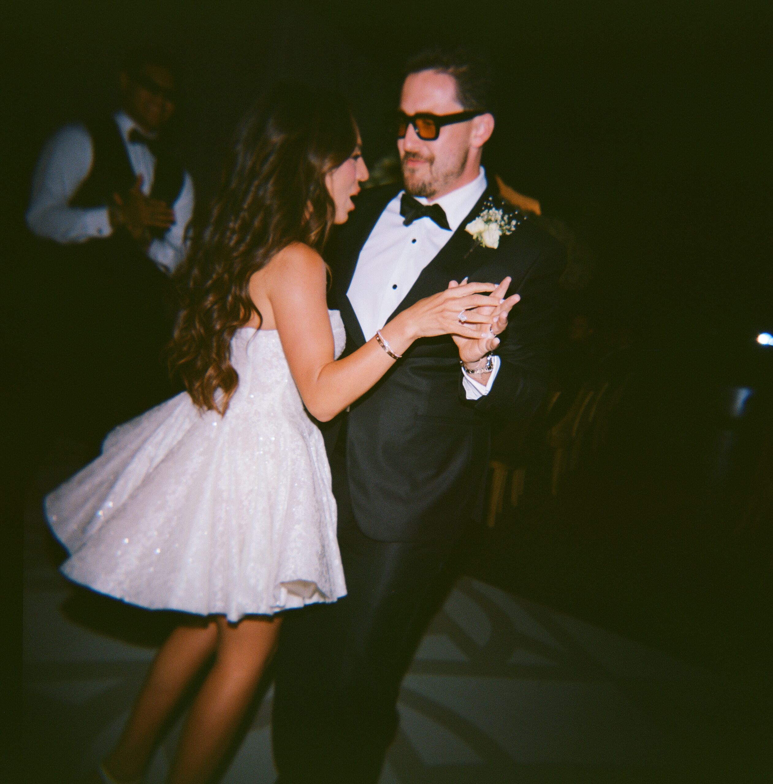 Film photo of bride and groom dancing during their wedding reception