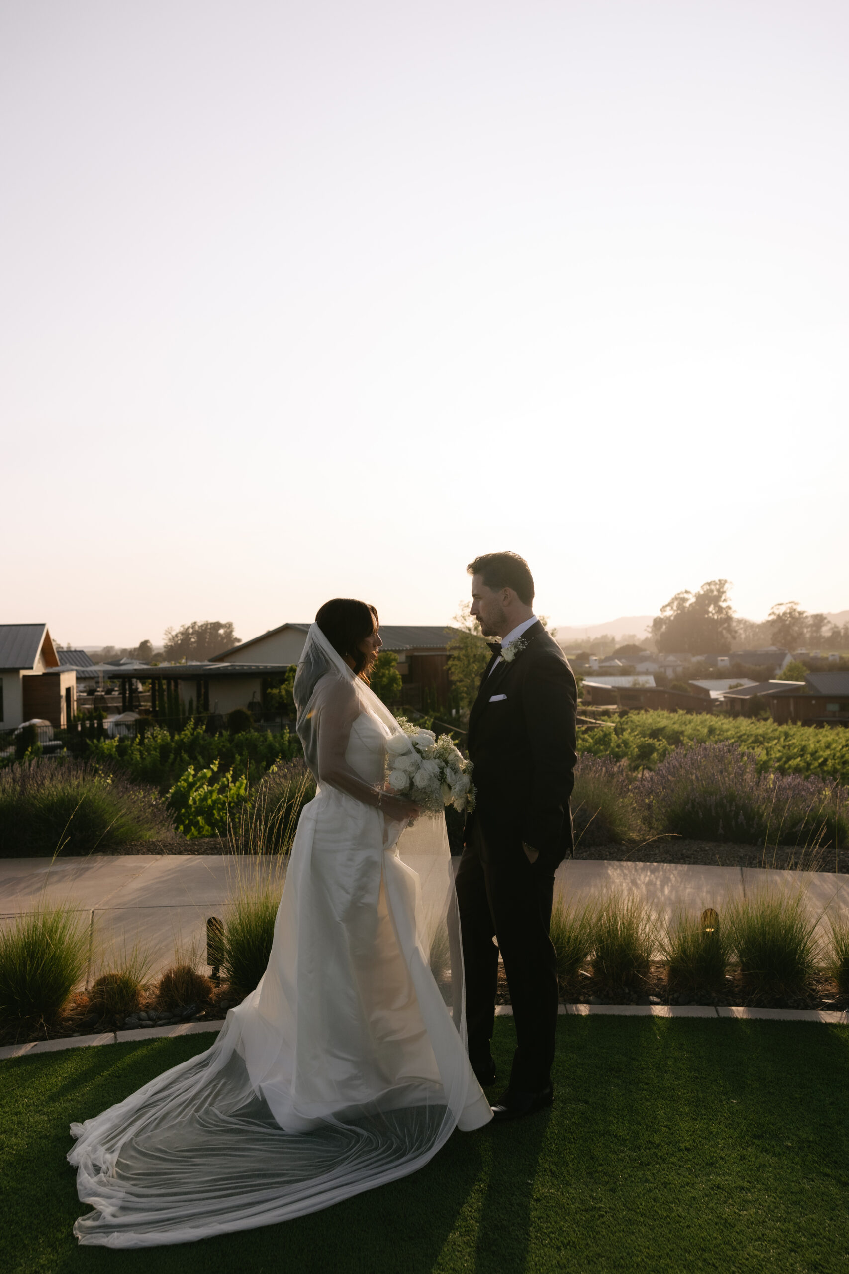 Bride and groom on the lavender lawn at Stanly Ranch