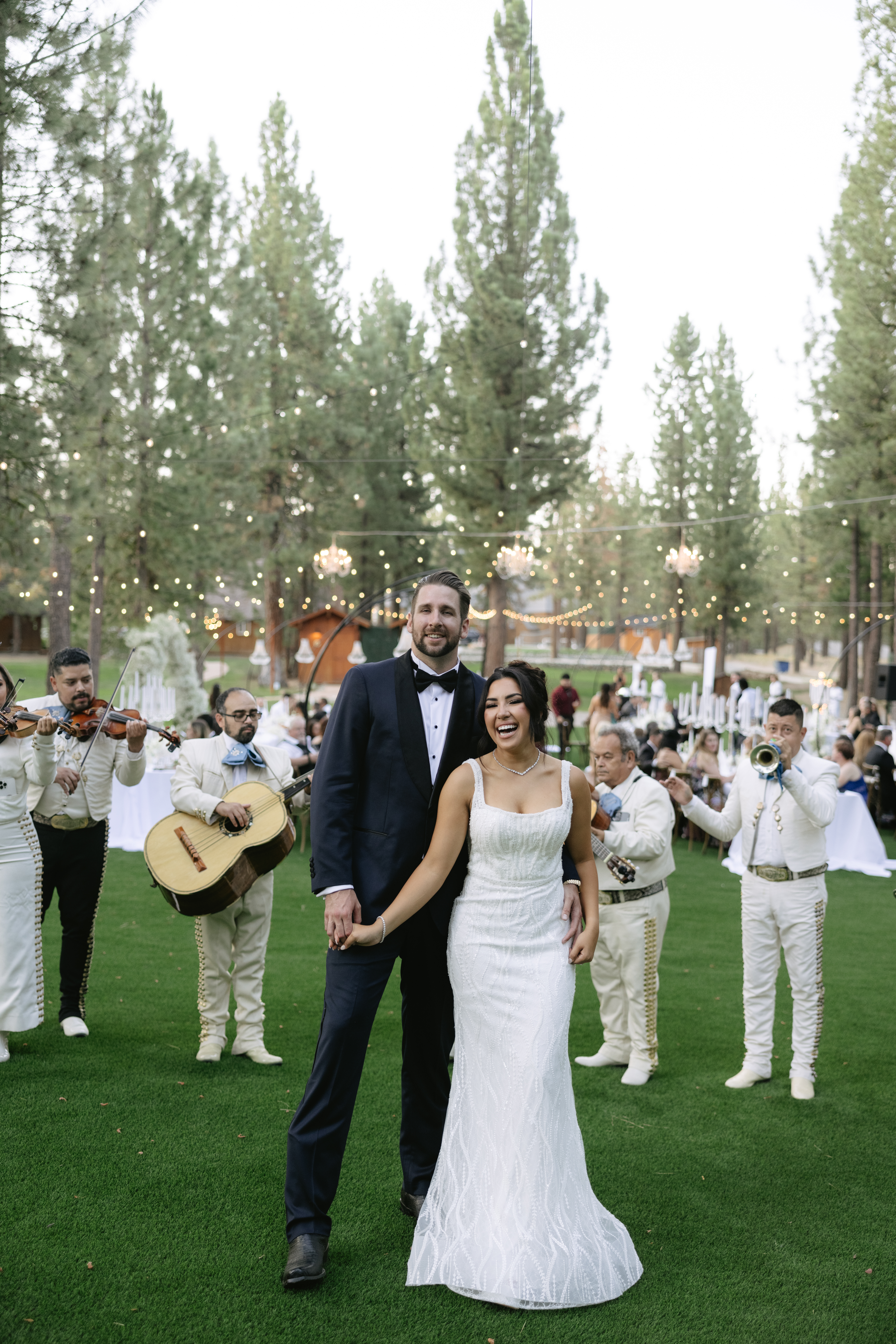 Couple at wedding listening to live mariachi band