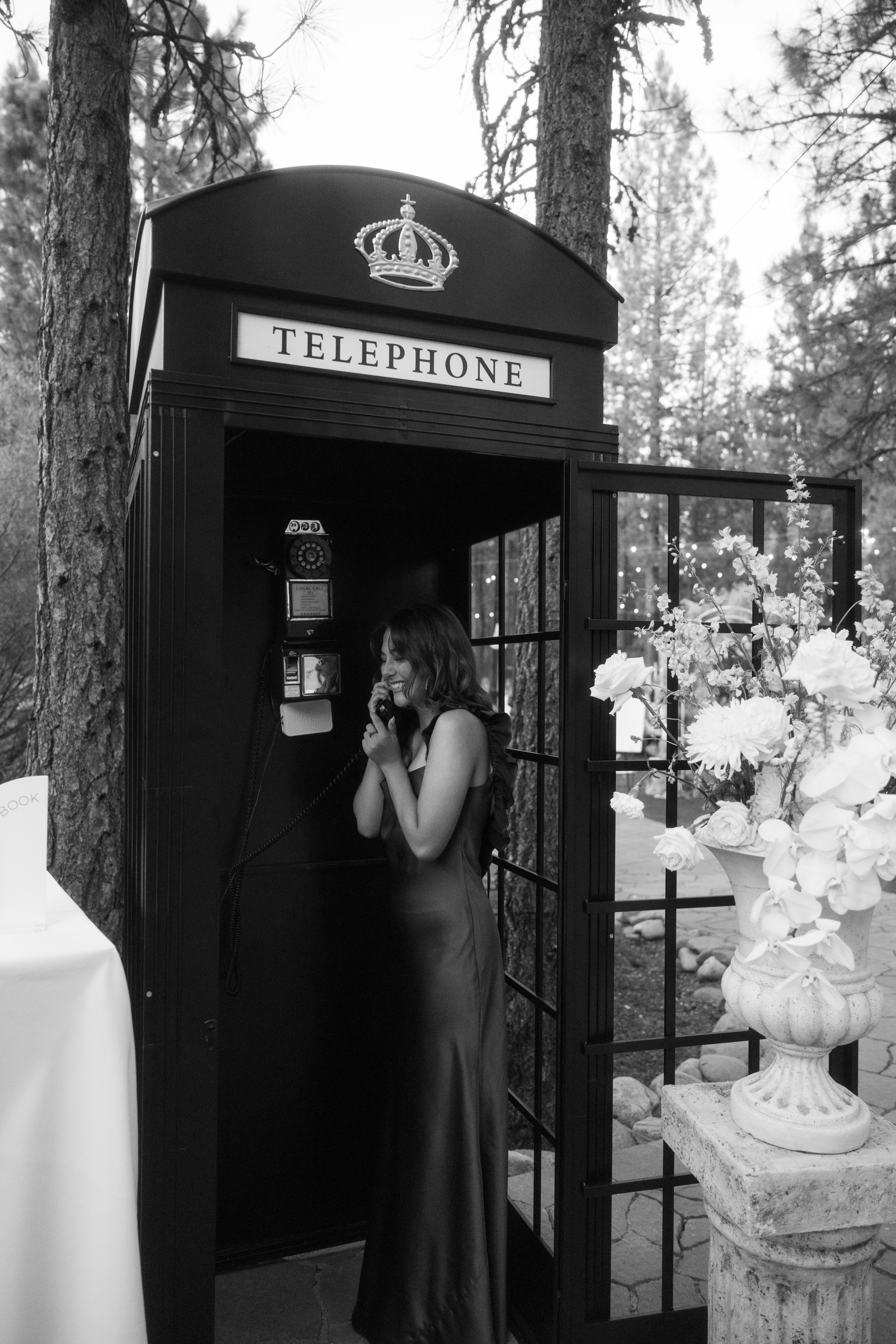 Guest leaving a message at a wedding audio guestbook telephone booth