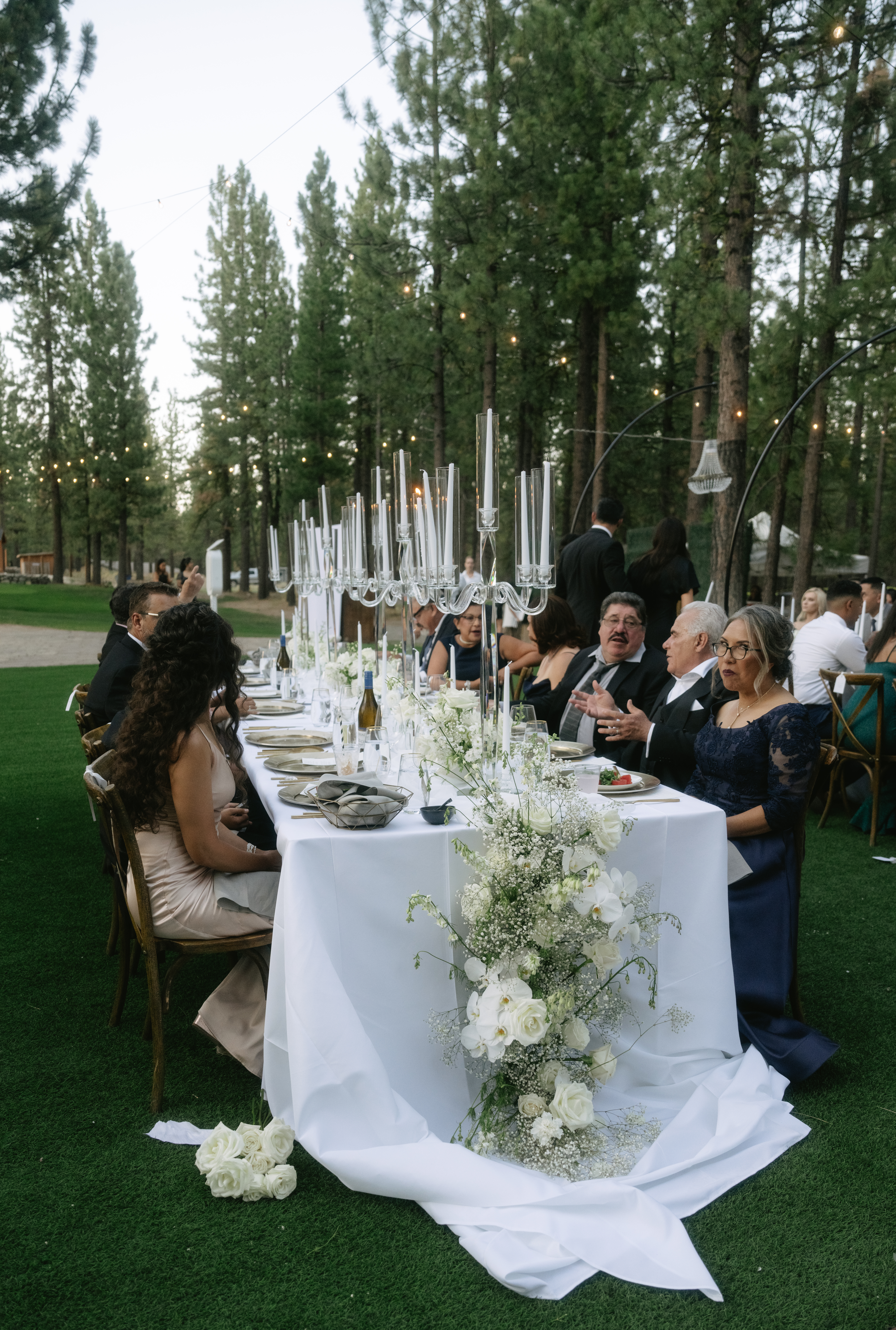 Wedding guests enjoying a family style wedding dinner