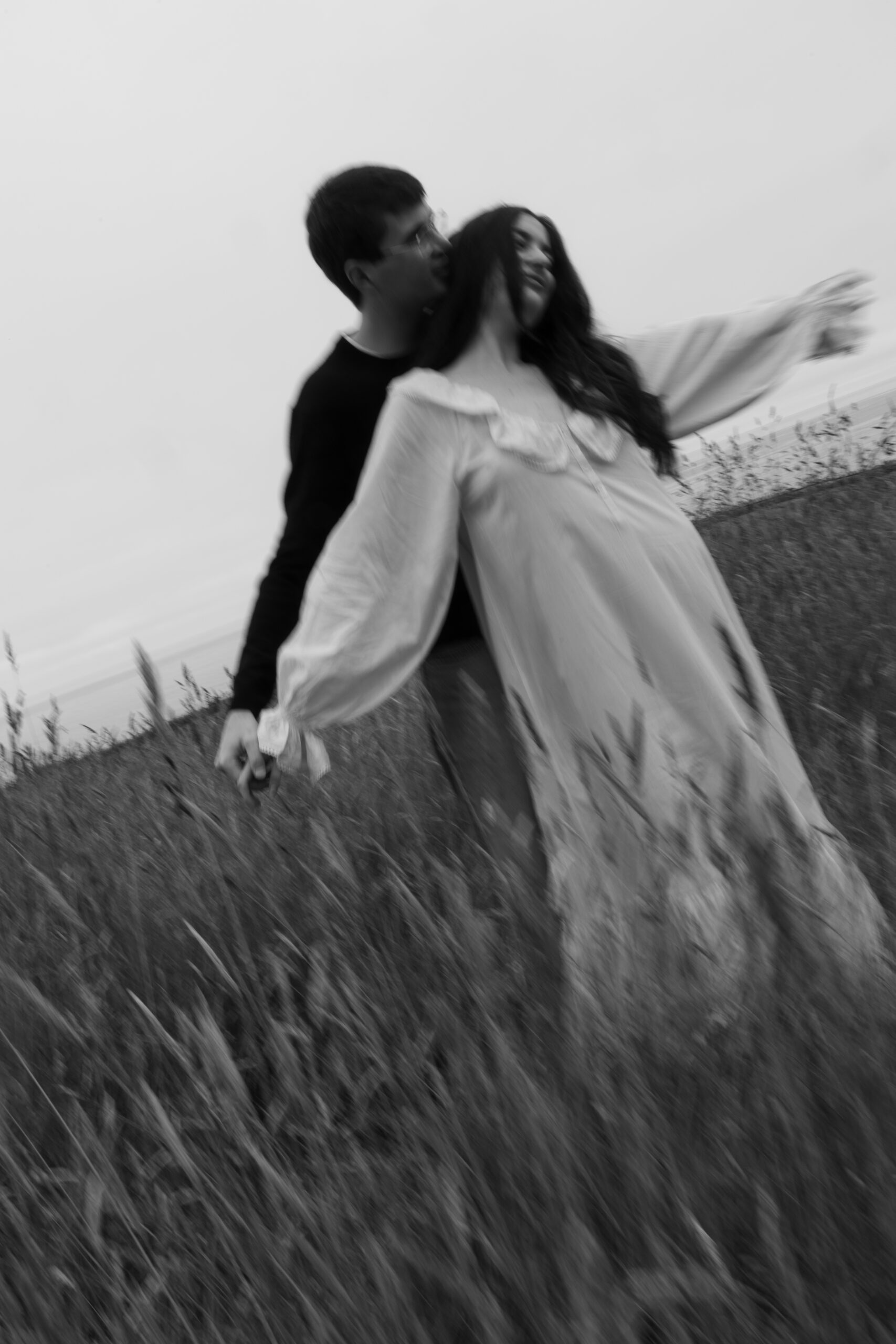 Blurry black and white photo of a couple on the morning of their wedding