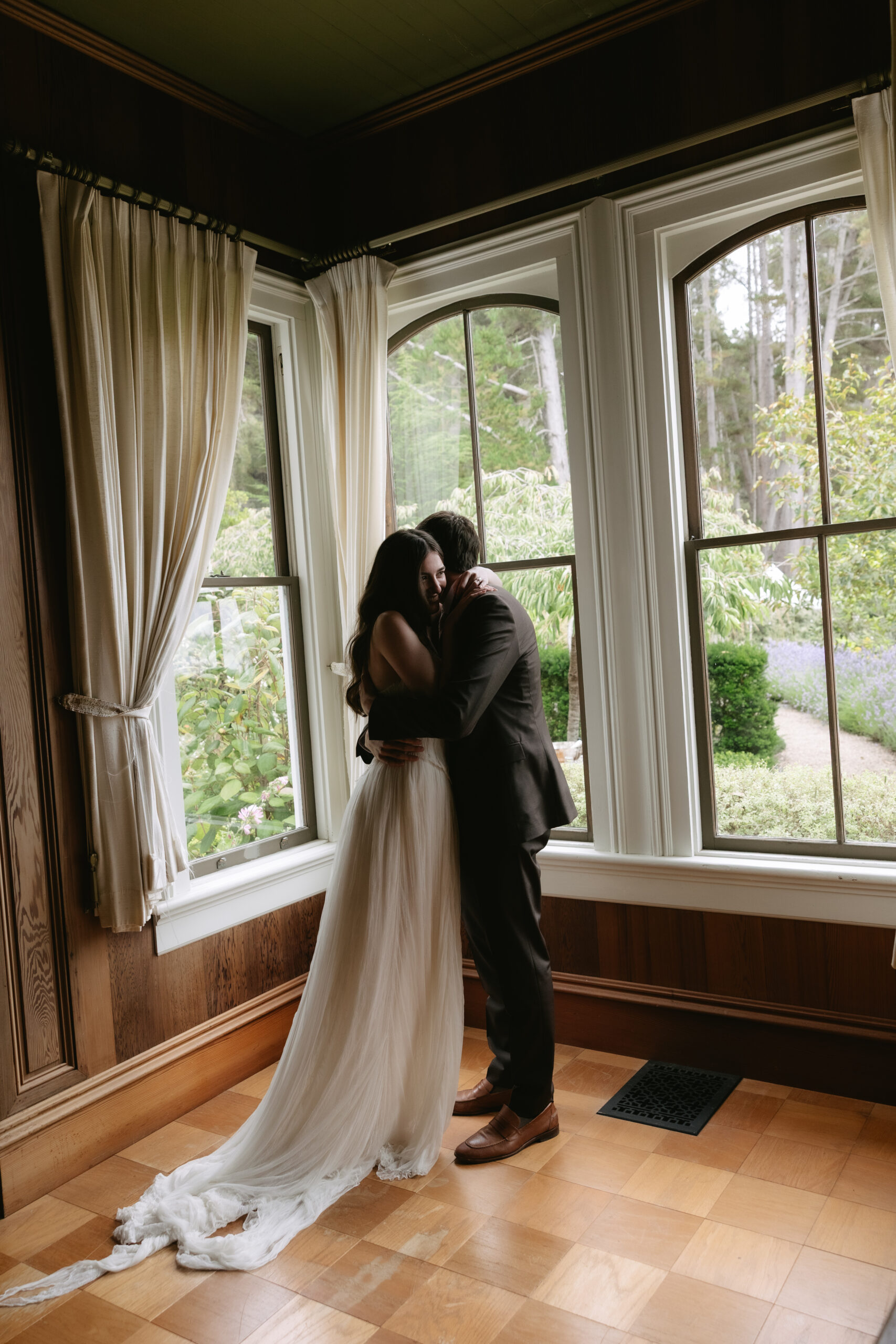 Bride and groom hugging after private first look