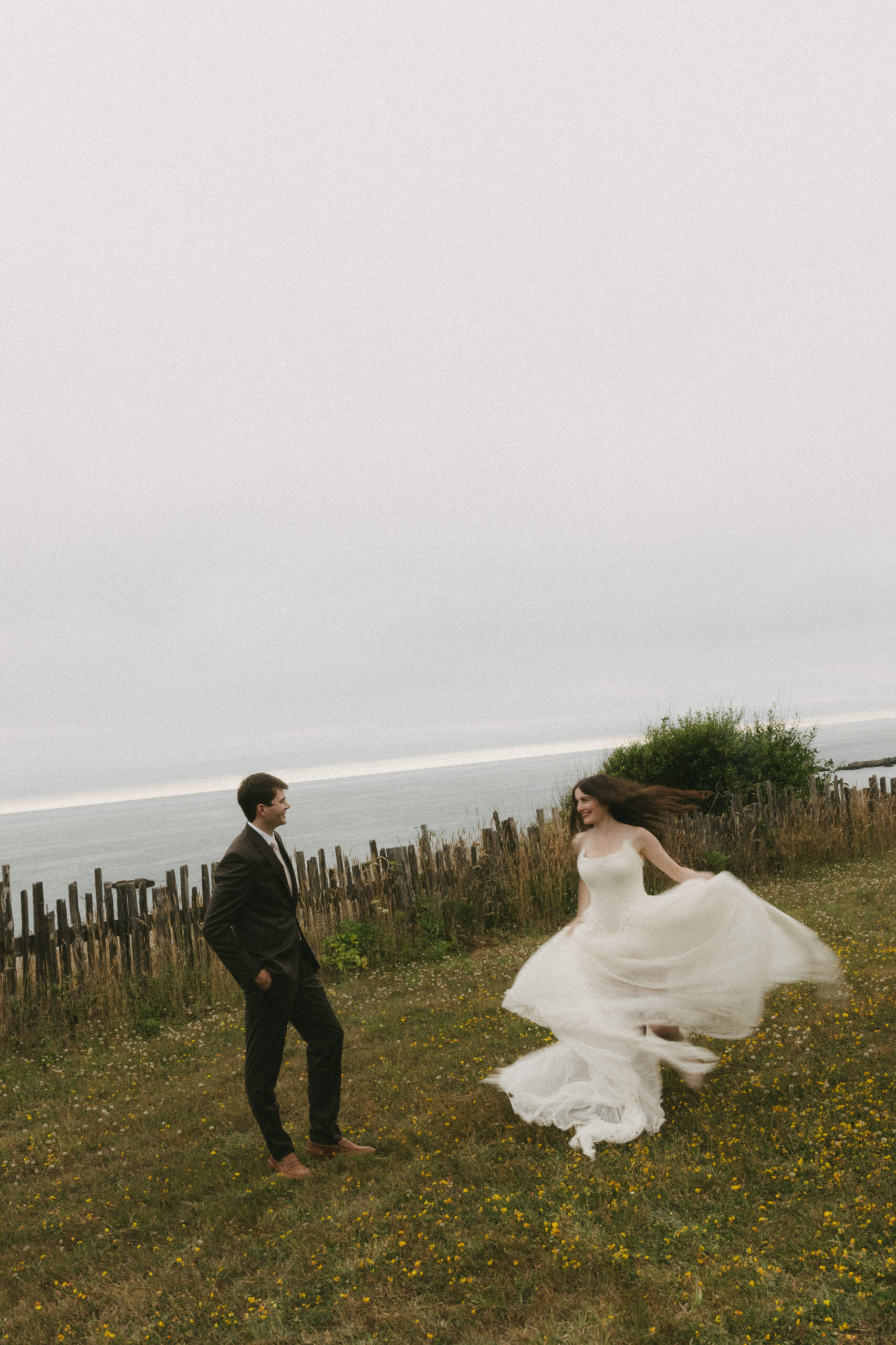 Bride spinning in wedding dress at Switzer Farm oceanfront wedding venue