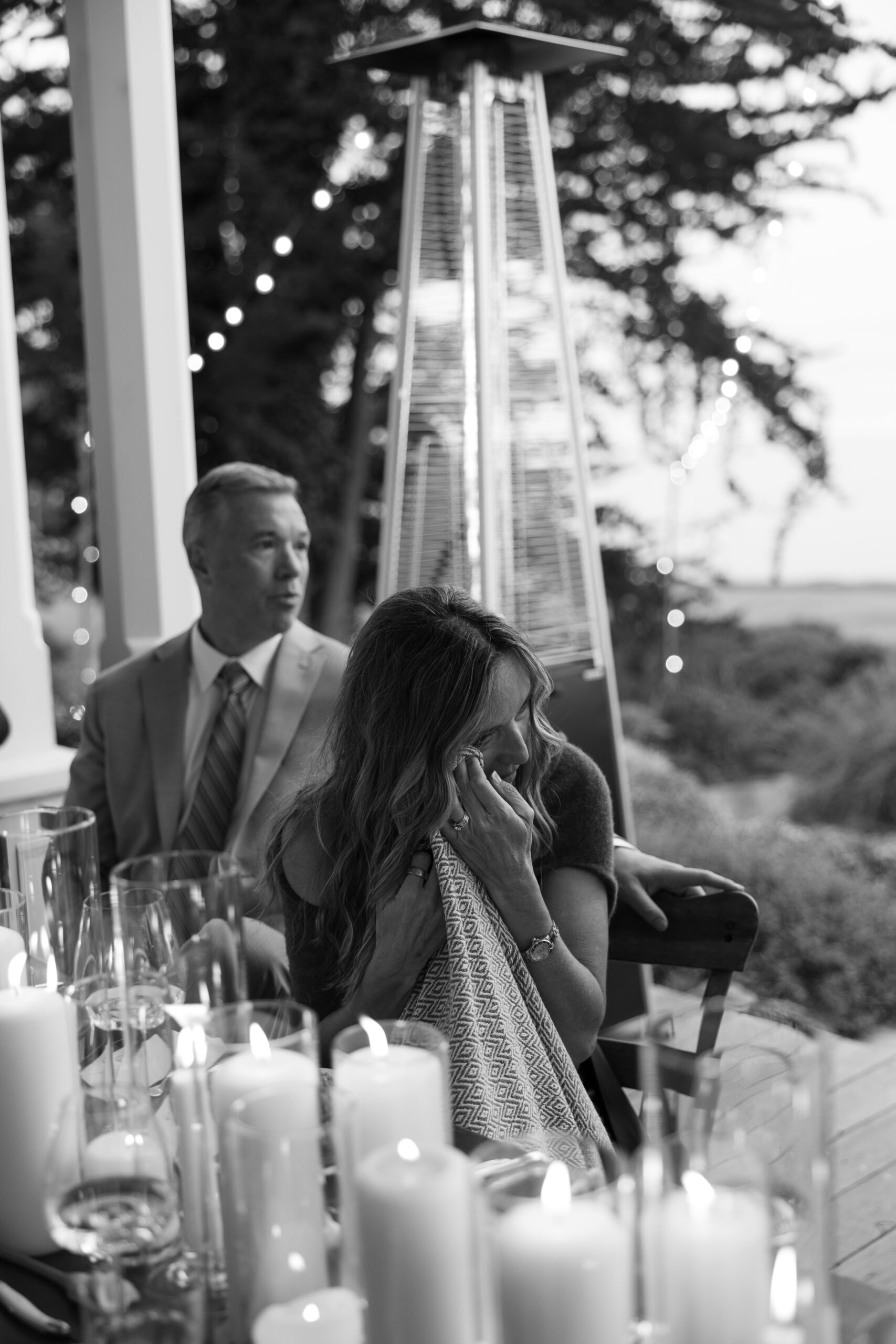 Wedding guest crying during toasts at wedding reception