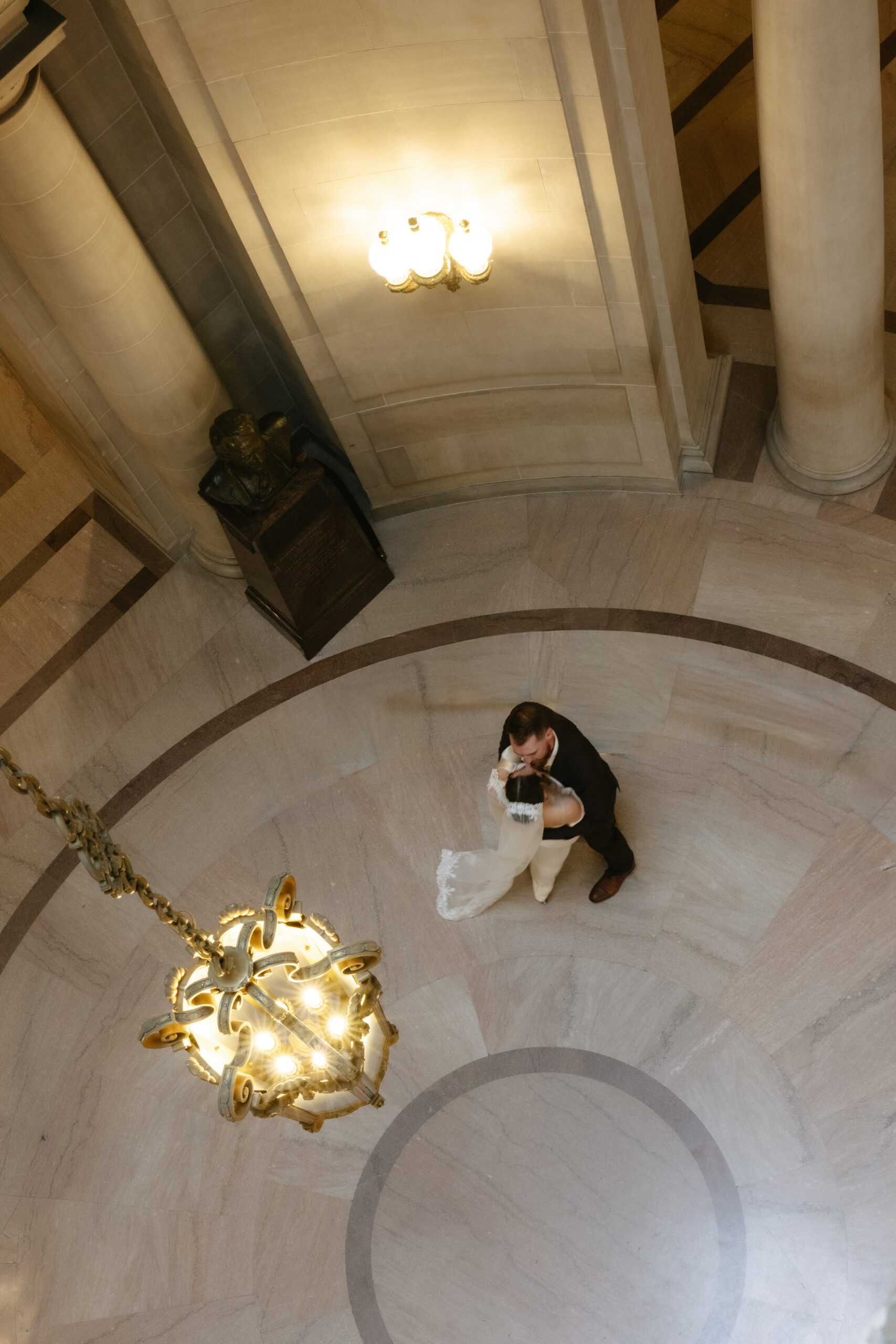 An arial view of a bride and groom dancing at their San Francisco city hall wedding