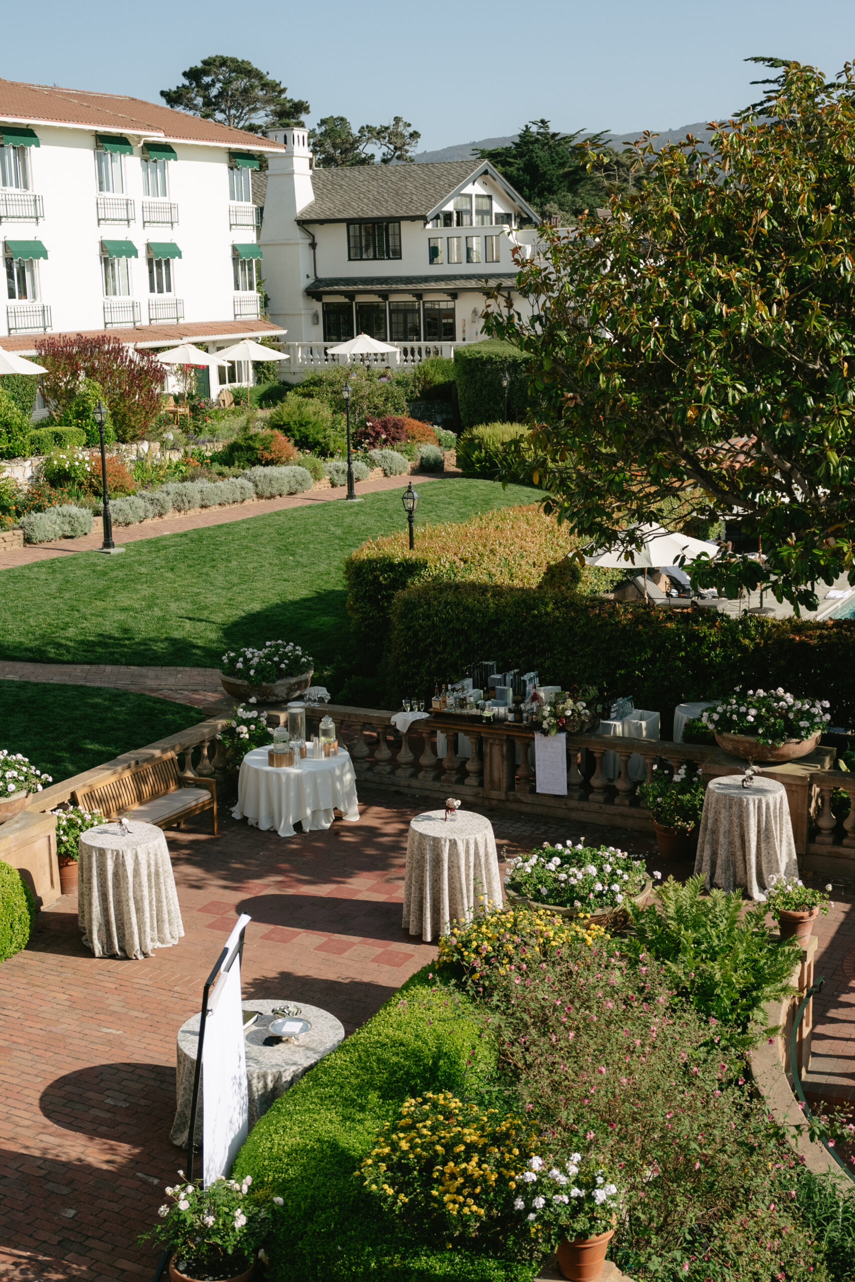An arial view of the courtyard at La Playa Hotel setup for a wedding cocktail hour