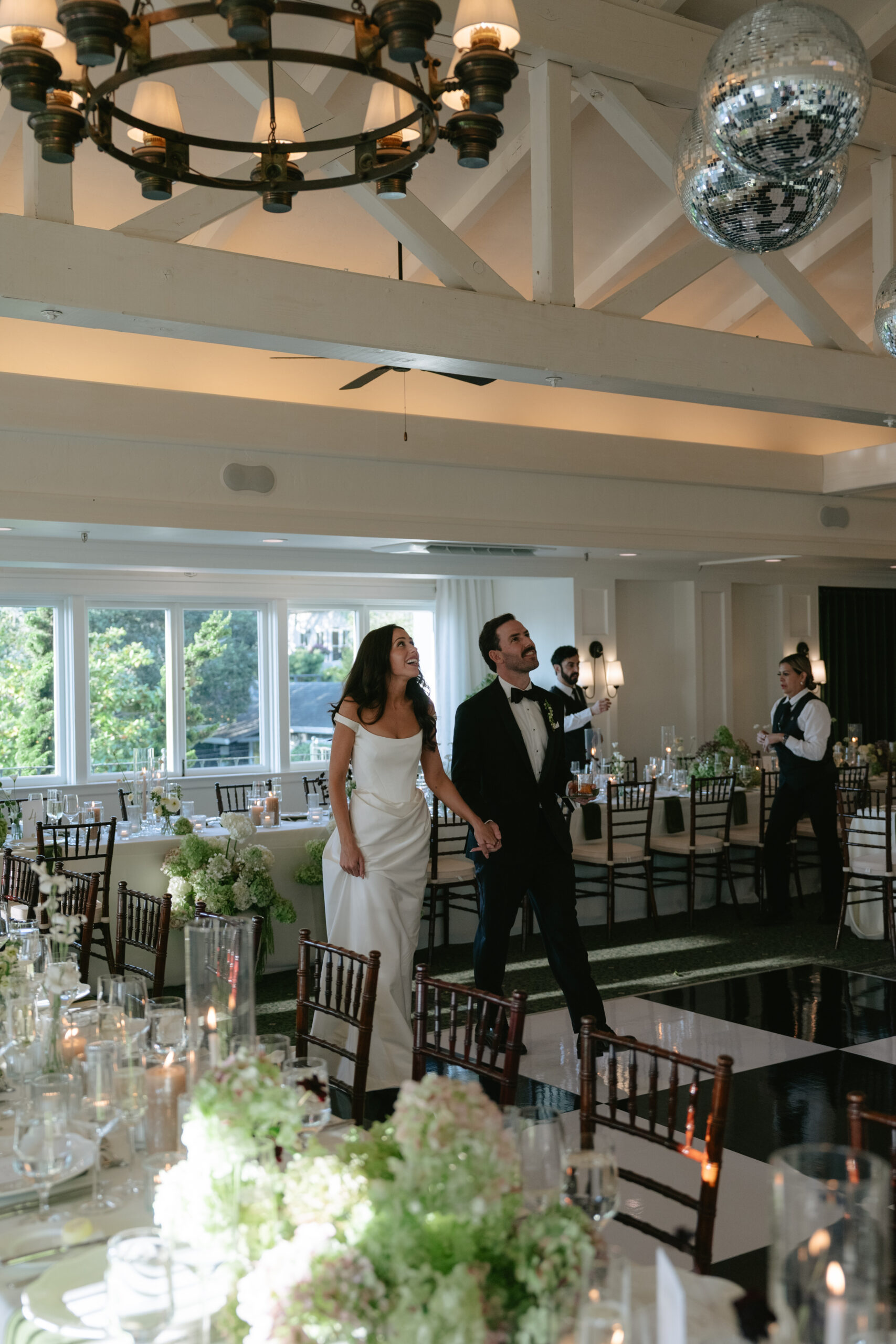Bride and groom looking at their wedding reception space setup