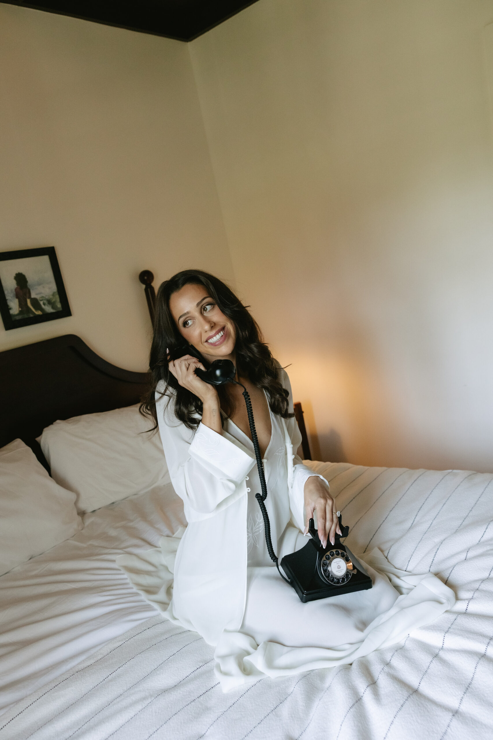 Bride talking on a phone during getting ready wedding photos
