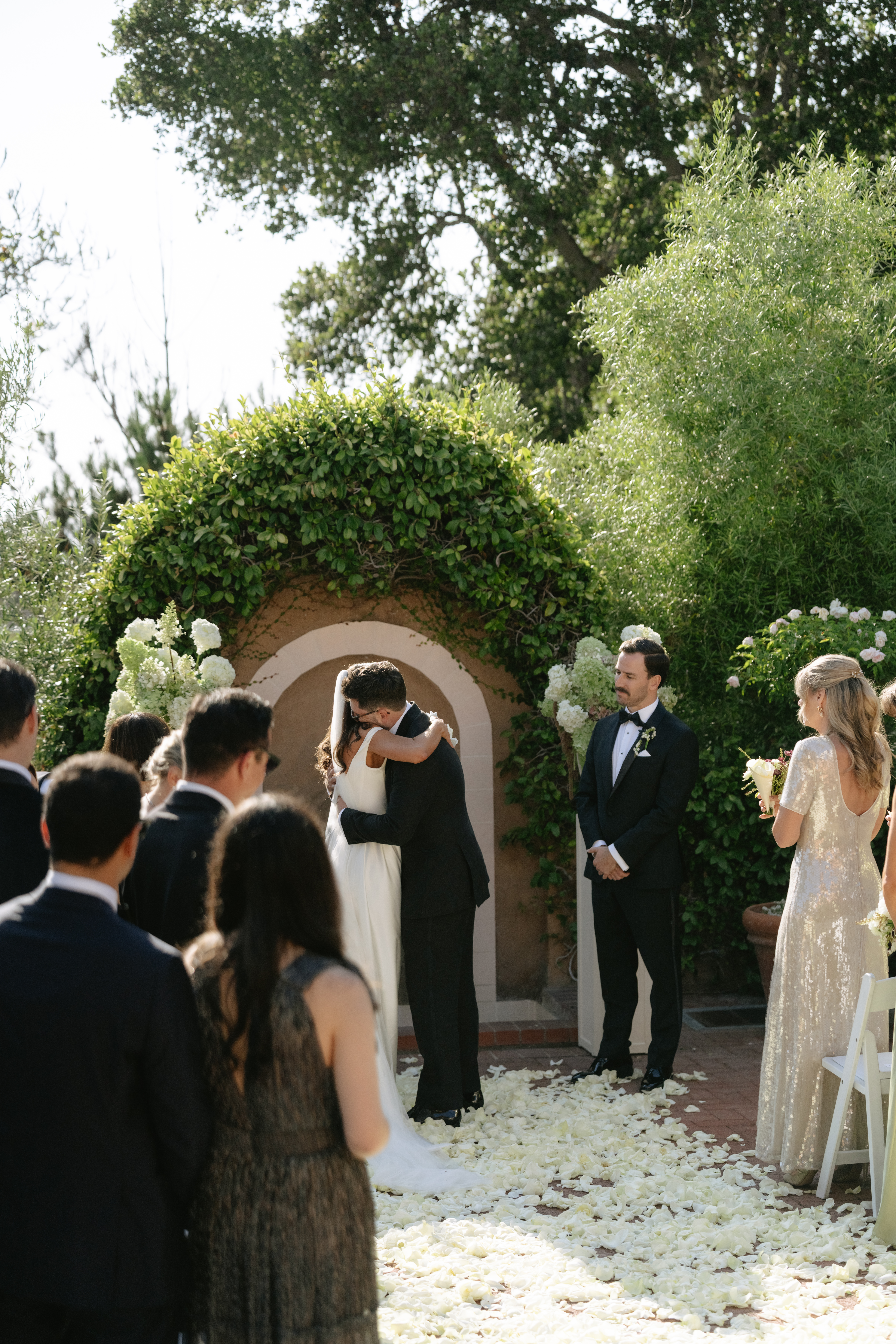 Bride hugging her brother after he walked her down the aisle