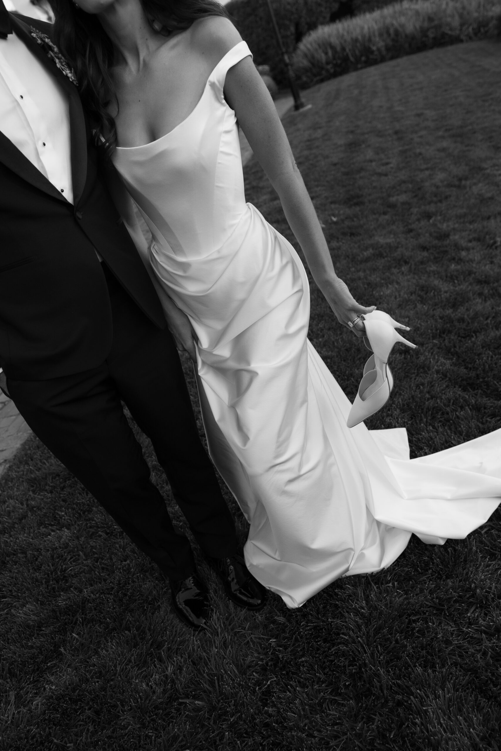 Editorial bride and groom photo showing off wedding outfits