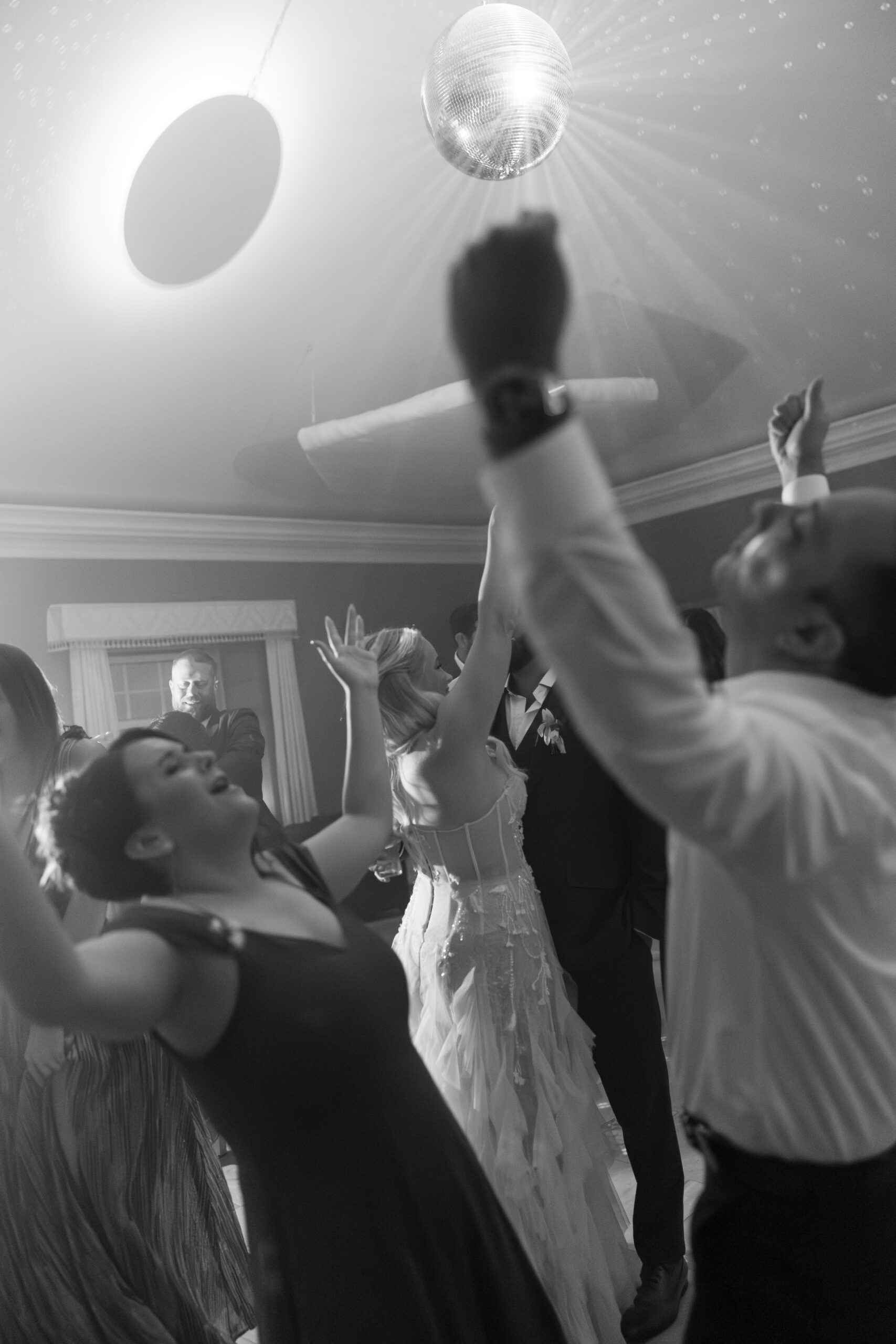 Candid photo of guests dancing at a wedding reception
