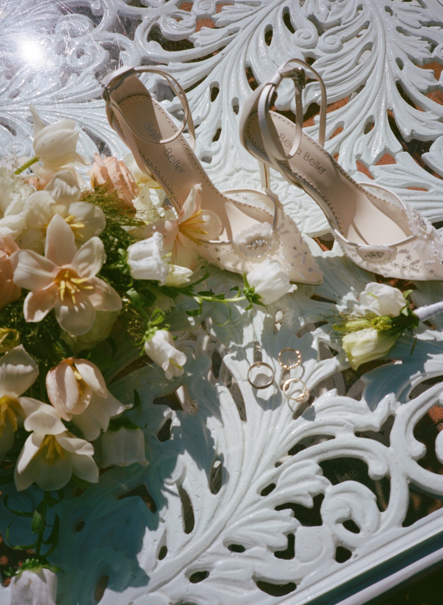 Film wedding photo from a destination wedding photographer of wedding jewelry and wedding flowers