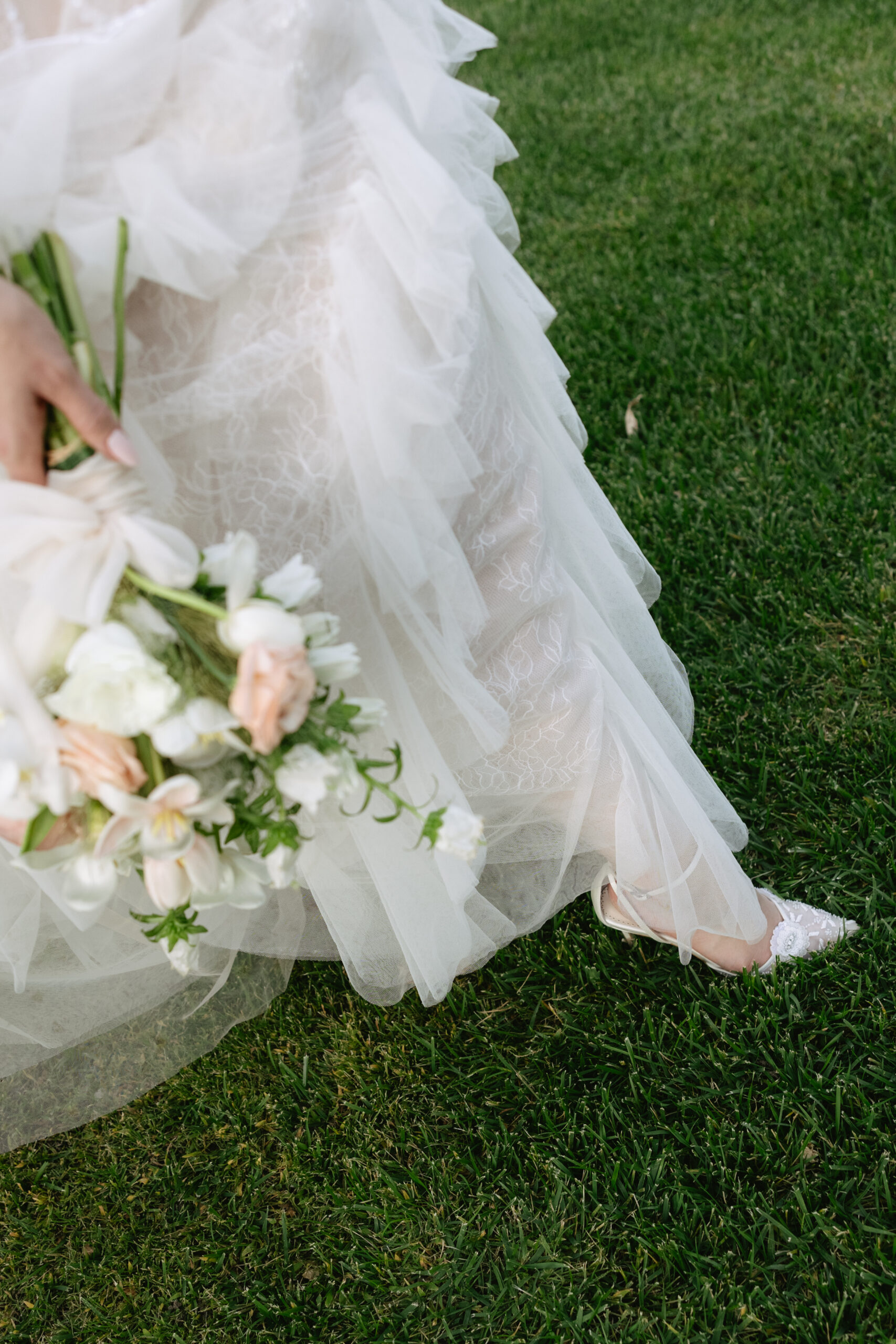Editorial wedding photo of bride's ethereal wedding dress while she's walking