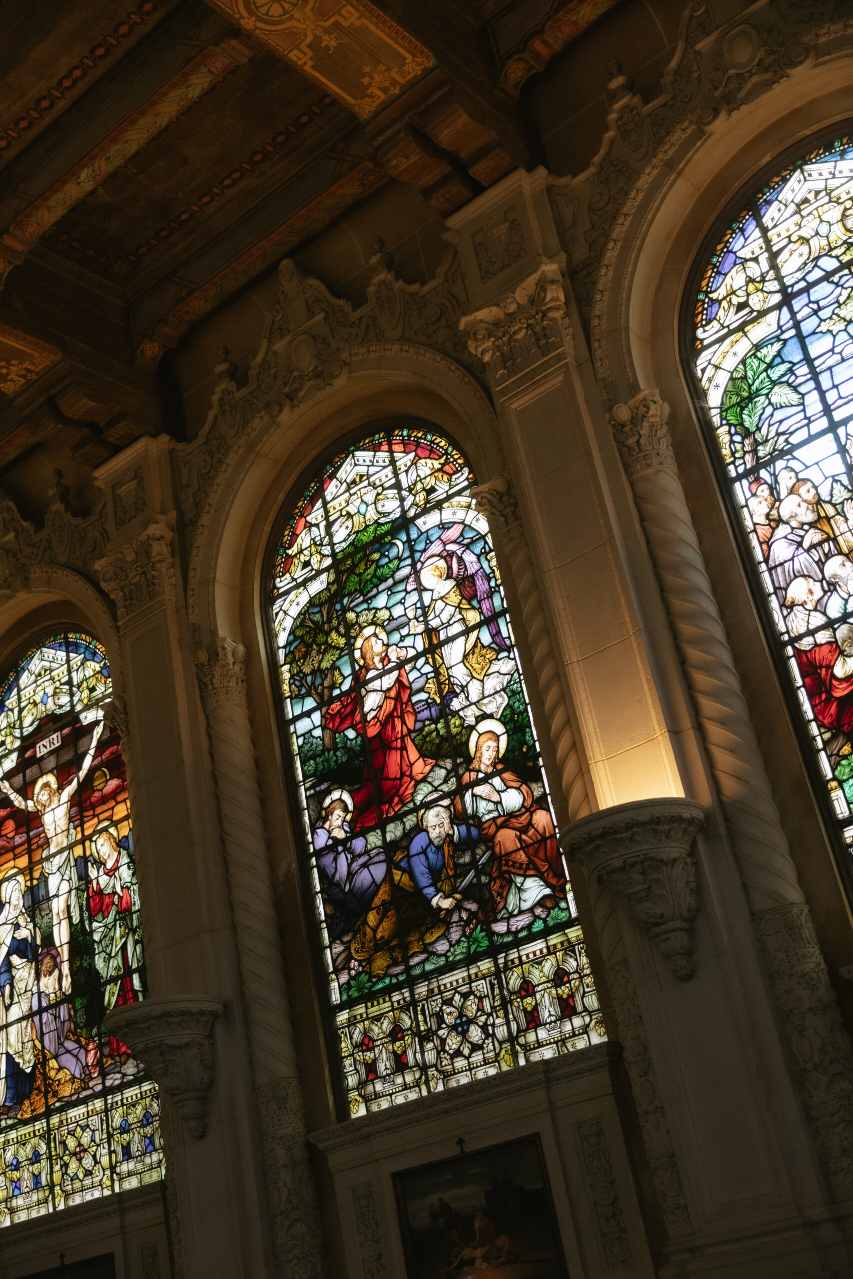 Stained glass windows inside of a Catholic church