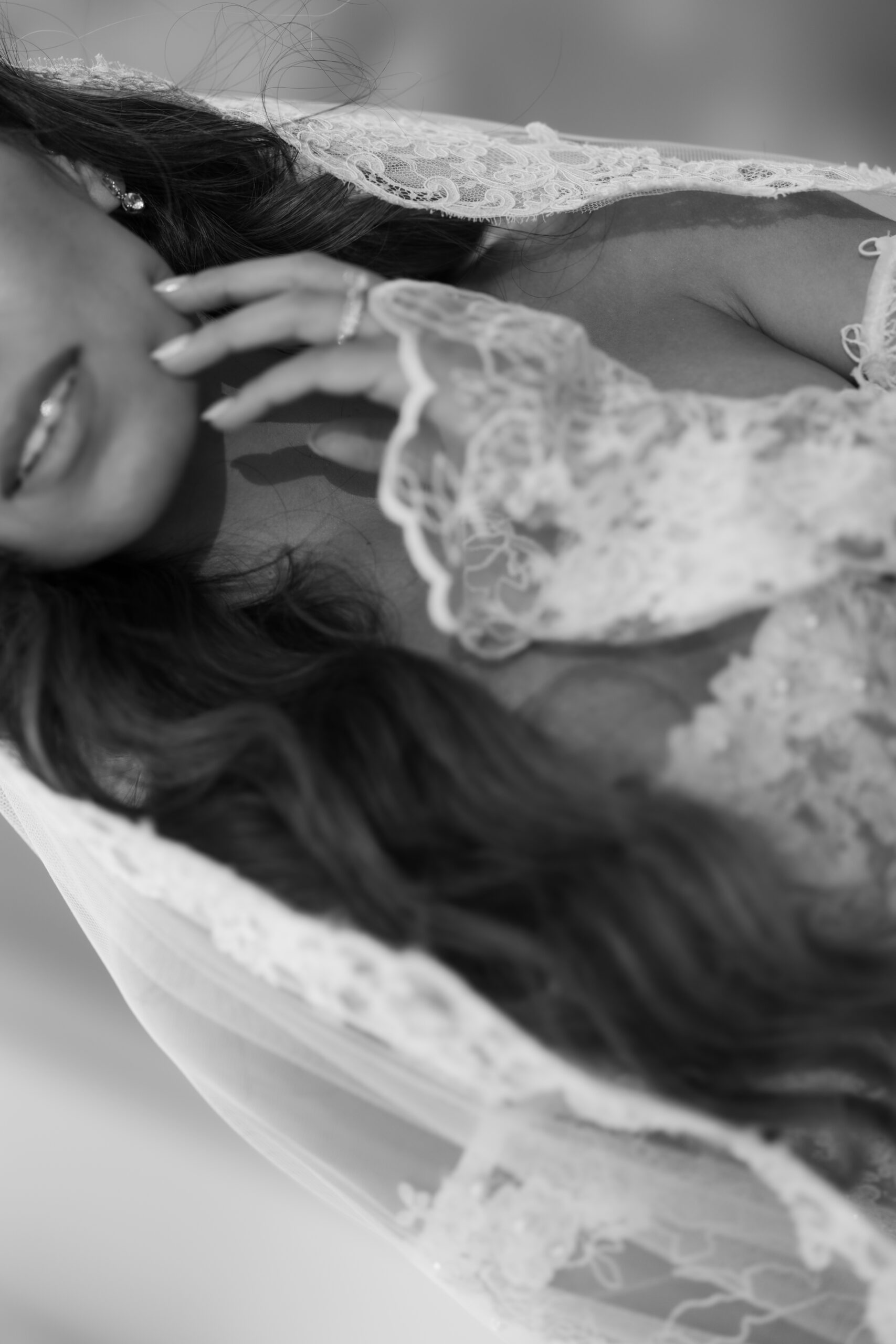 An up close bridal portrait of a bride's lace wedding dress