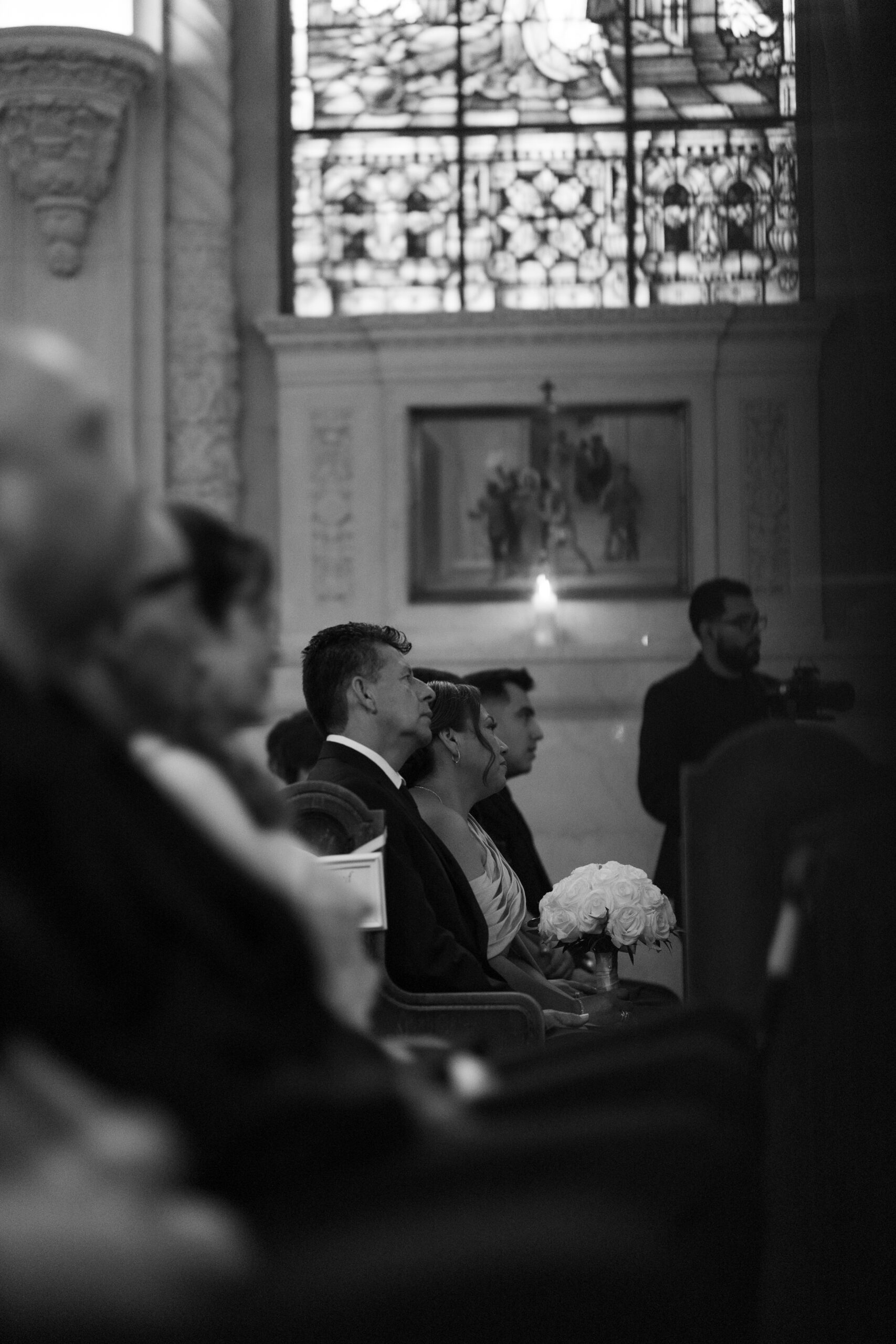 Guests watching a Catholic wedding ceremony
