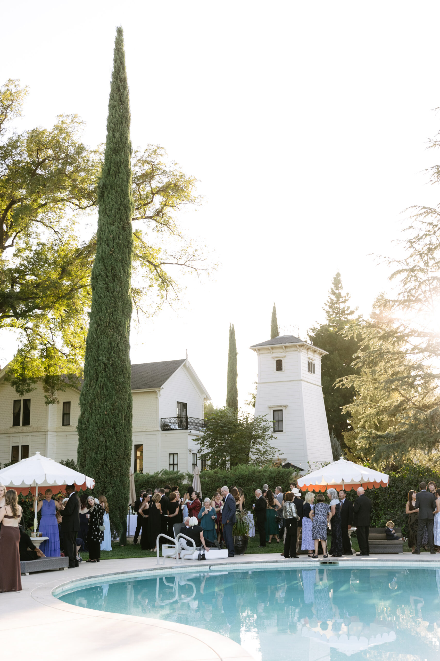 An outdoor cocktail hour by a pool