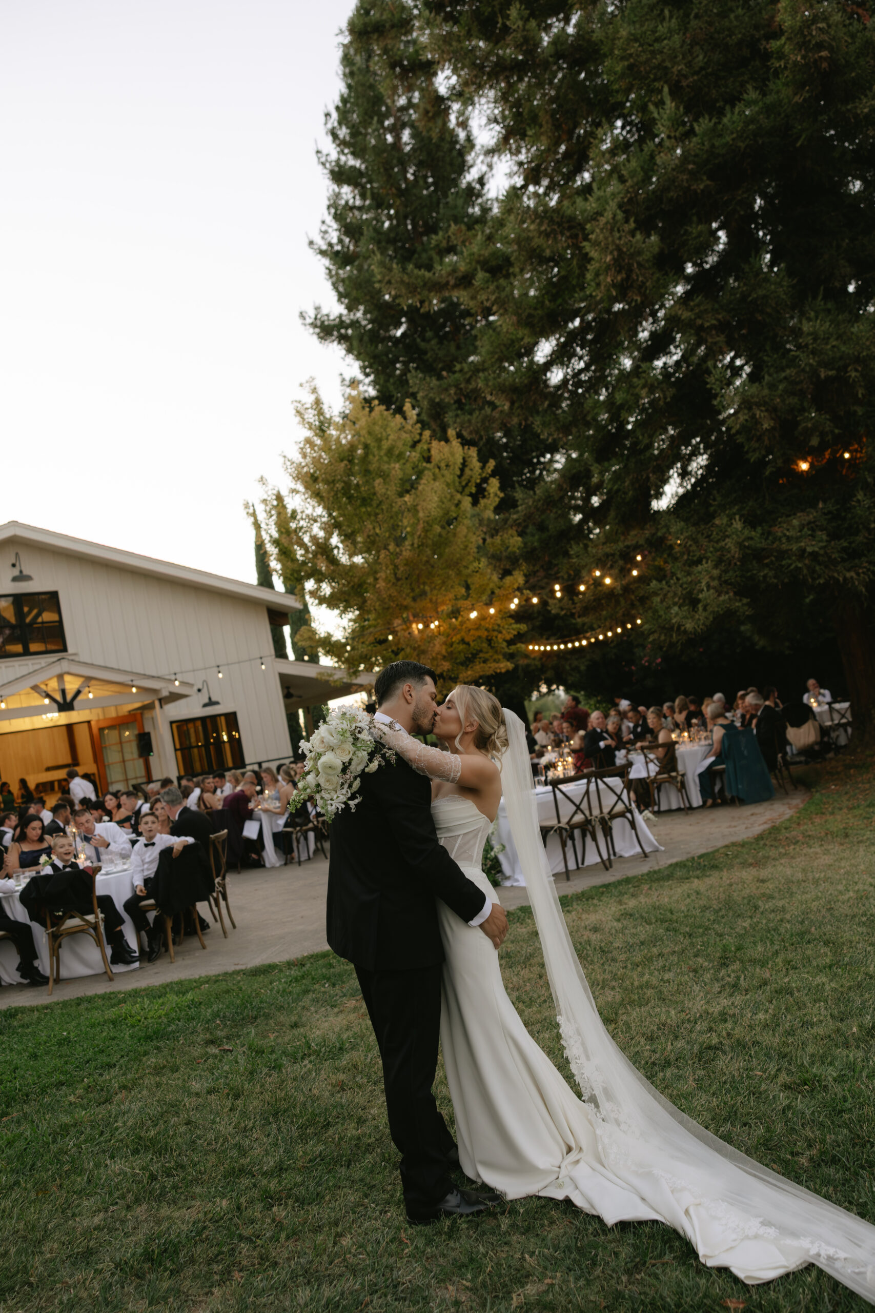 A couple kissing during their Park Winters wedding reception