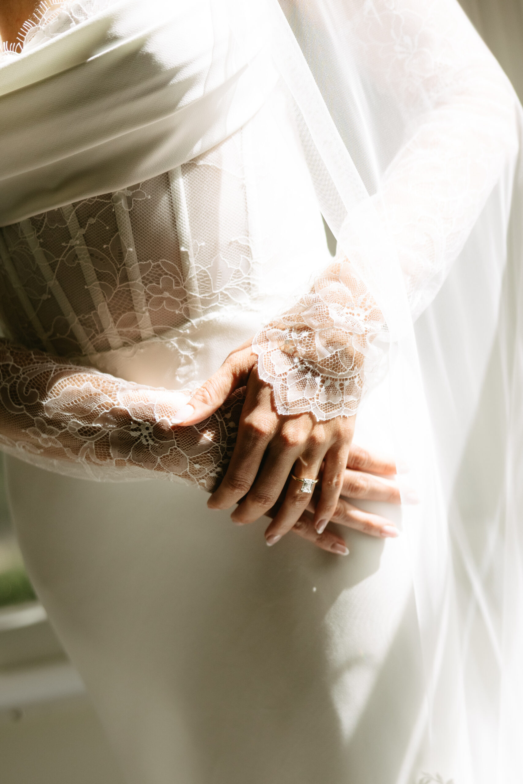 An up close photo of the details on a bride's wedding dress