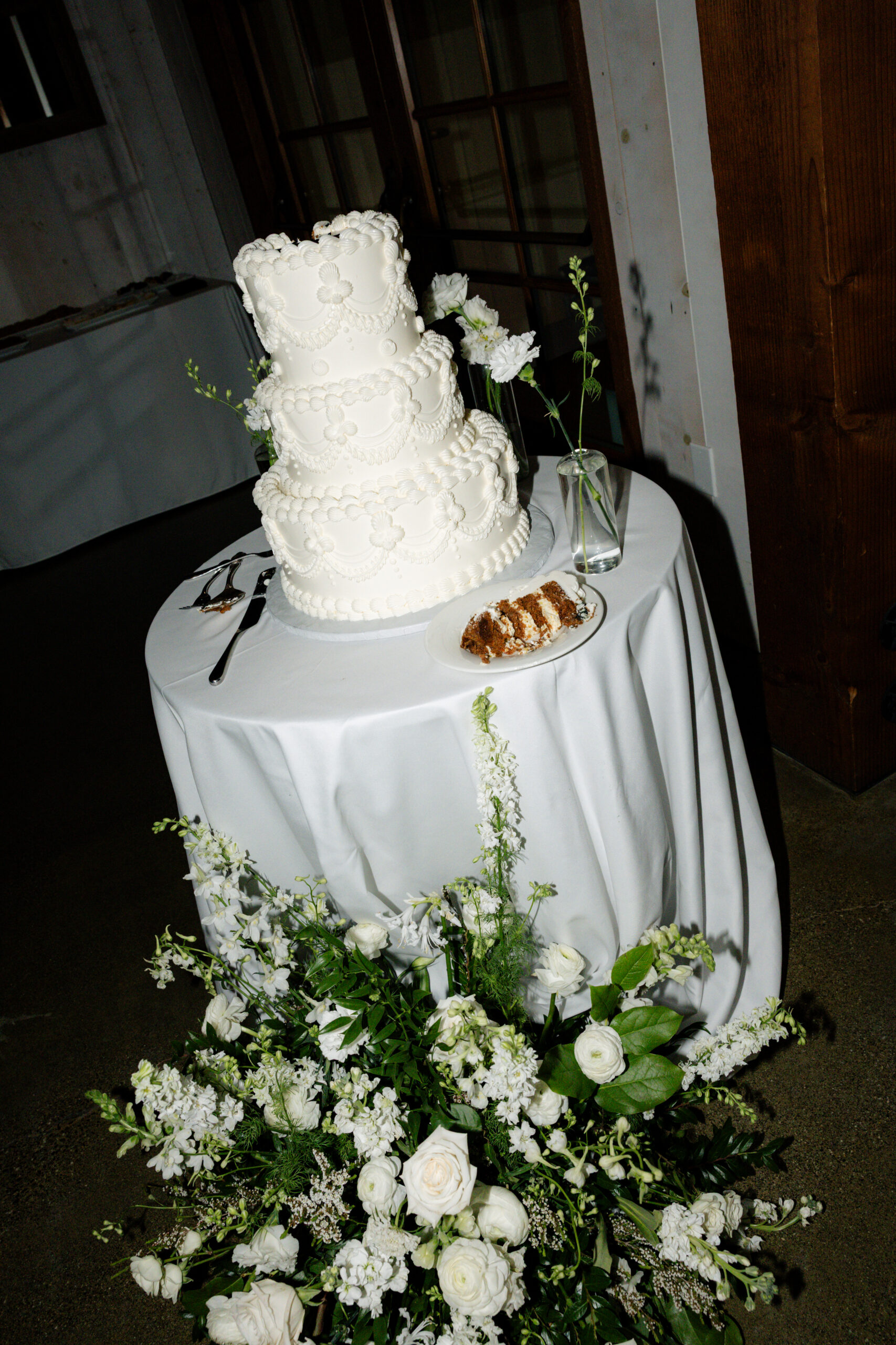 A wedding cake set up inside a park winters wedding reception