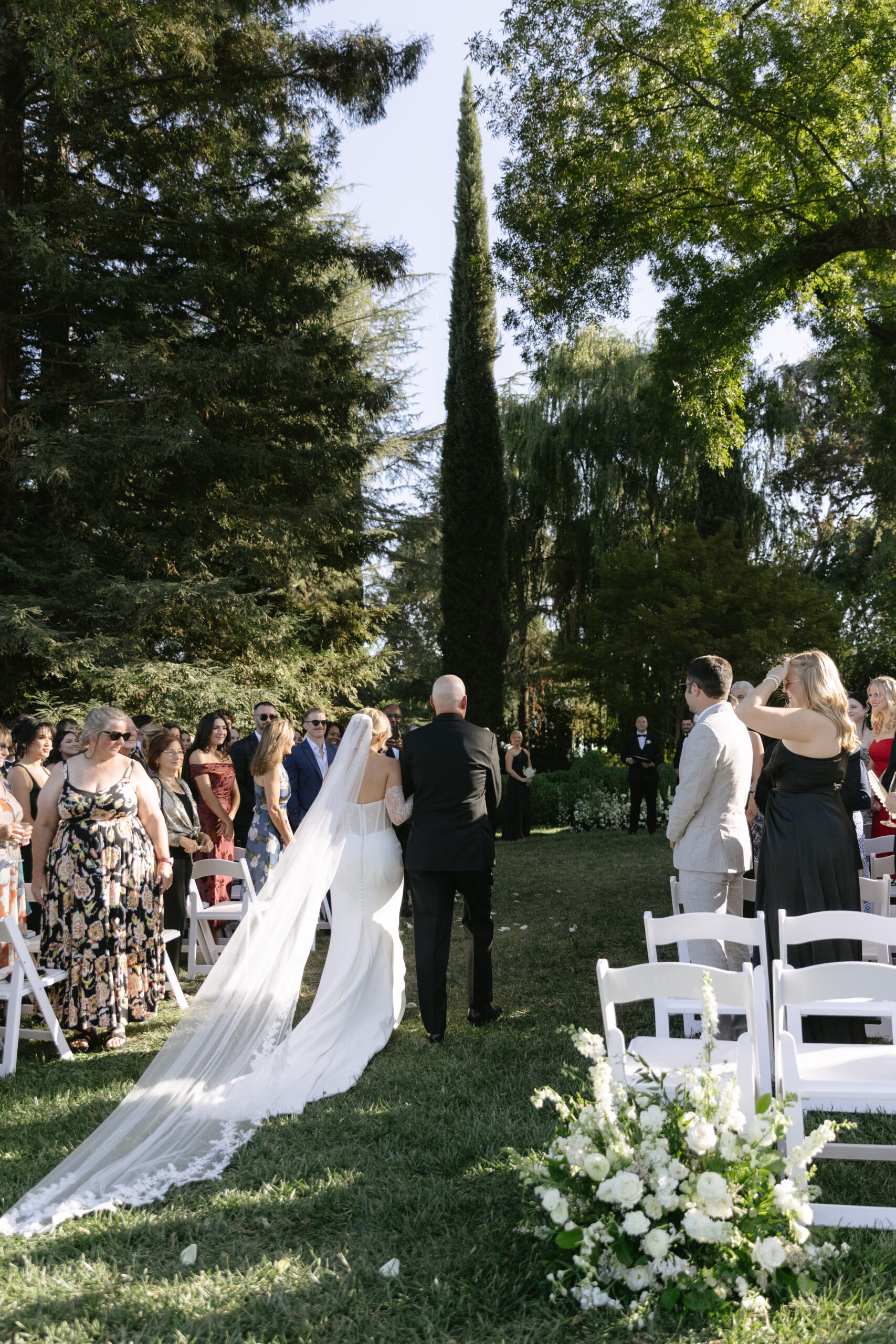 A bride walking down the aisle with her dad