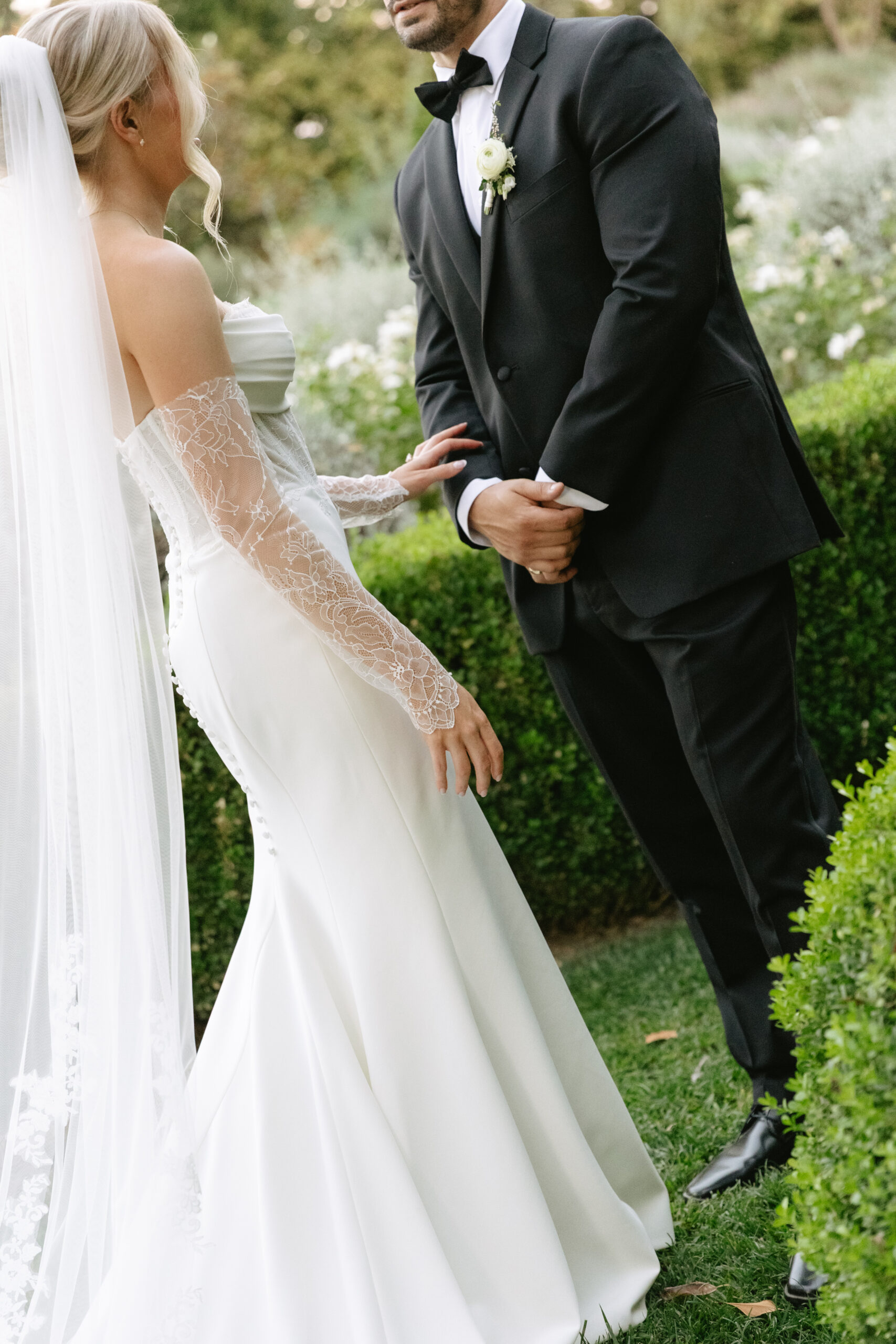 A bride and groom in the gardens at their California wedding venue, Park Winters