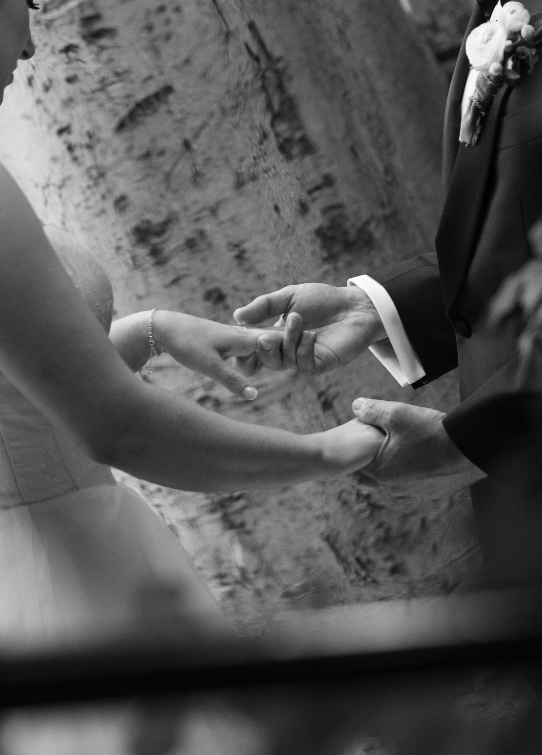 A couple holding hands, captured with documentary style wedding photography