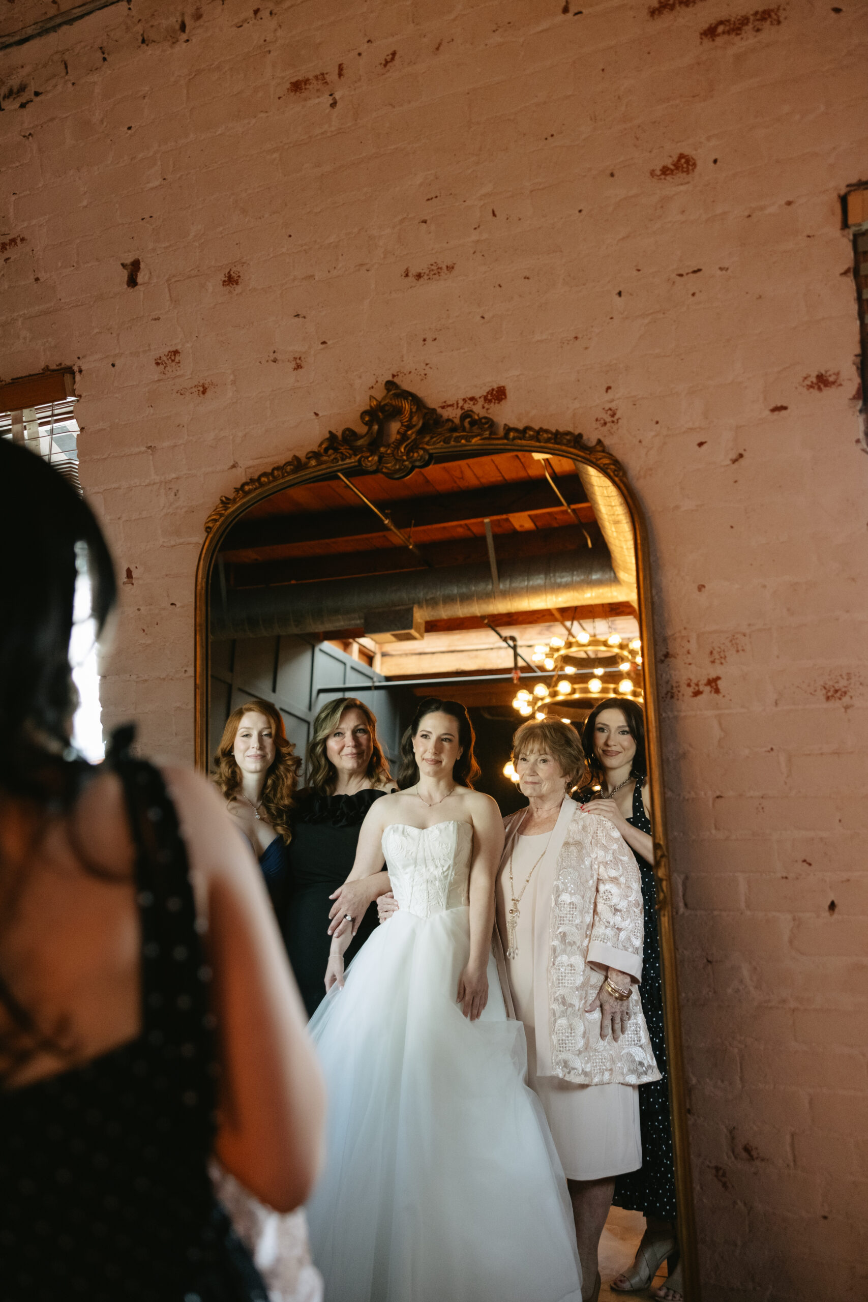 A bride and group of women getting ready for a wedding at the carondelet house Los Angeles Wedding venue