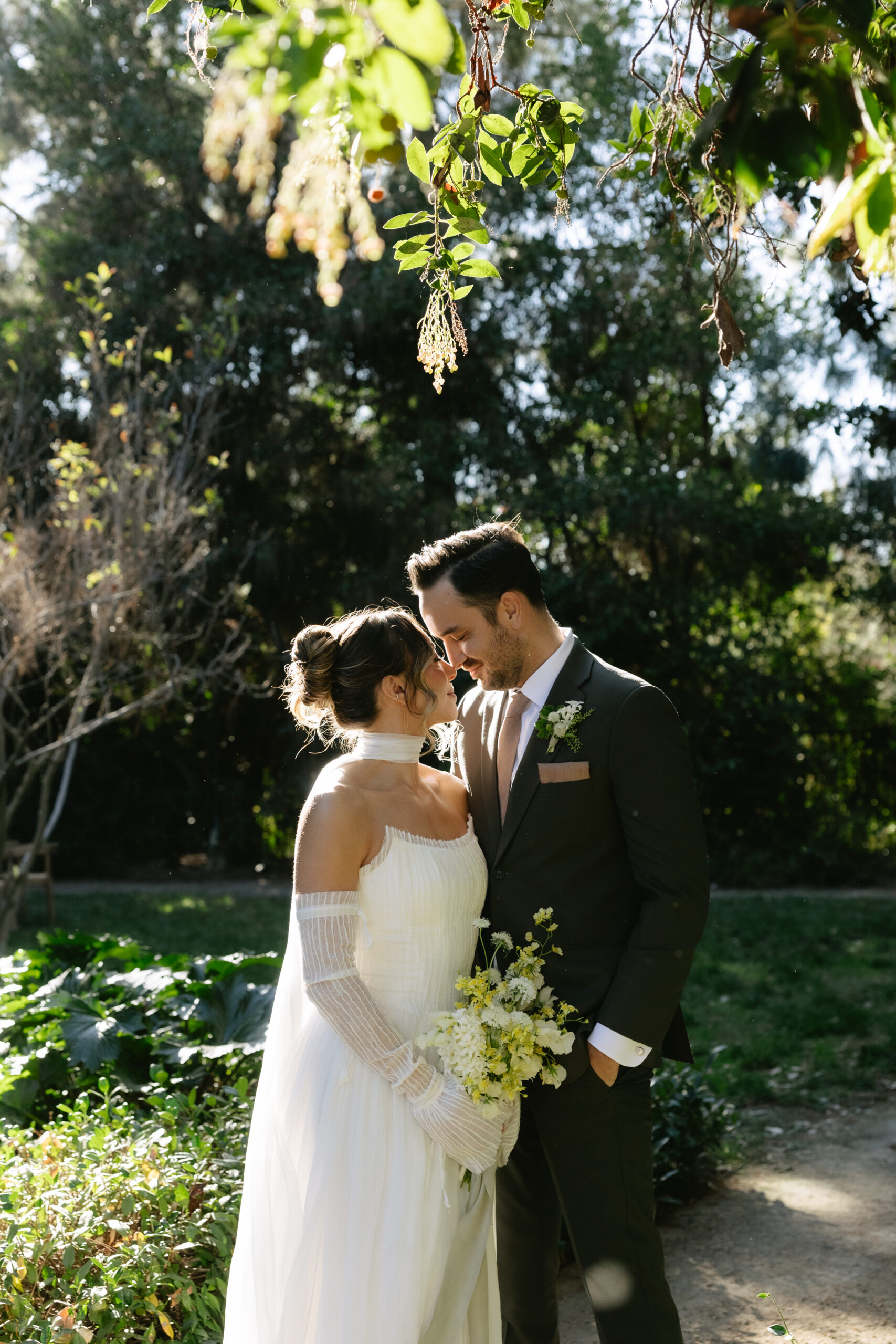 A bride and groom posing for photos at an etienne estate styled shoot