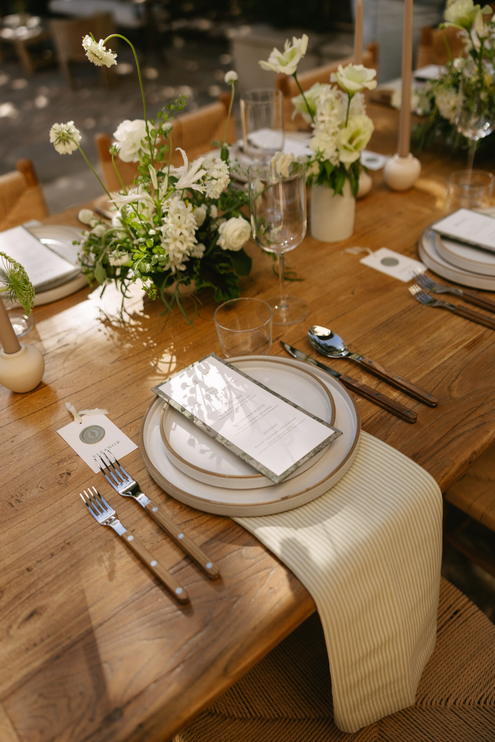 A wedding table setup with floral centerpieces