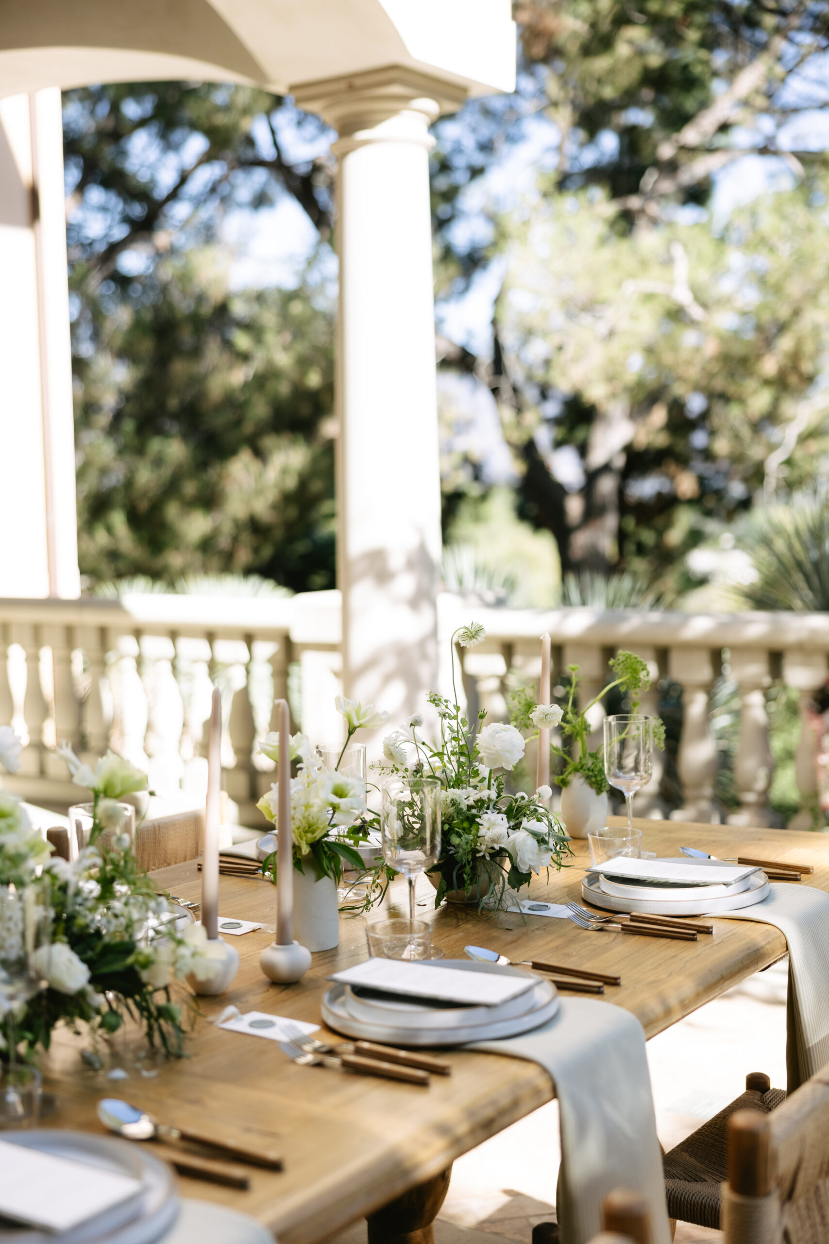 A wedding table setup with floral centerpieces