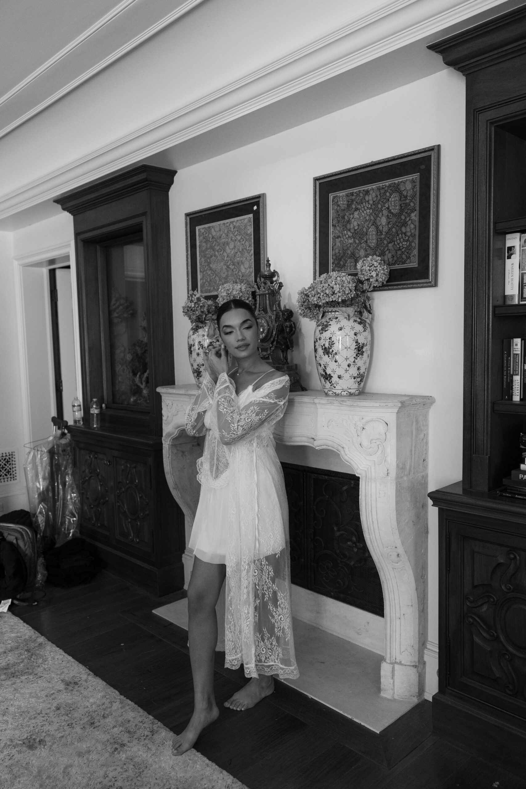 A bride model getting ready for a styled shoot putting on earrings