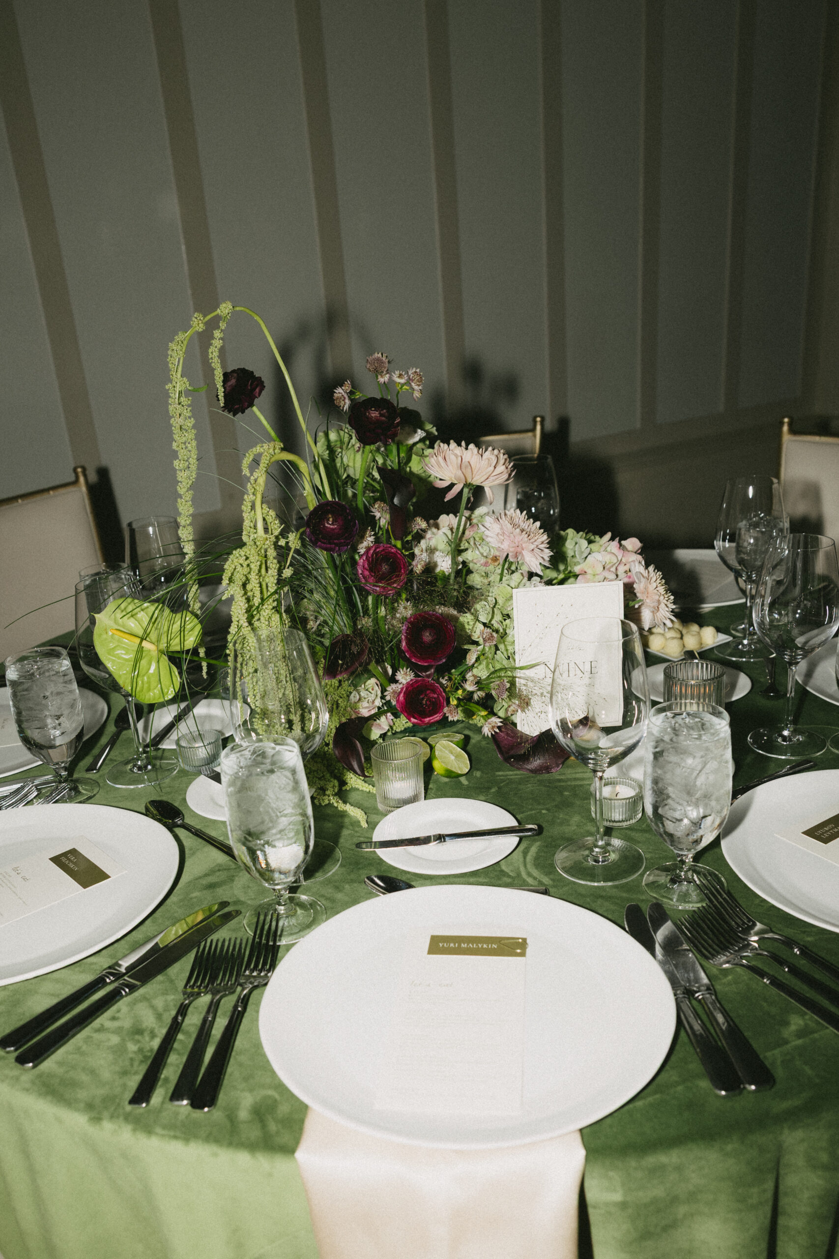 A green wedding table setup for a luxury wedding reception