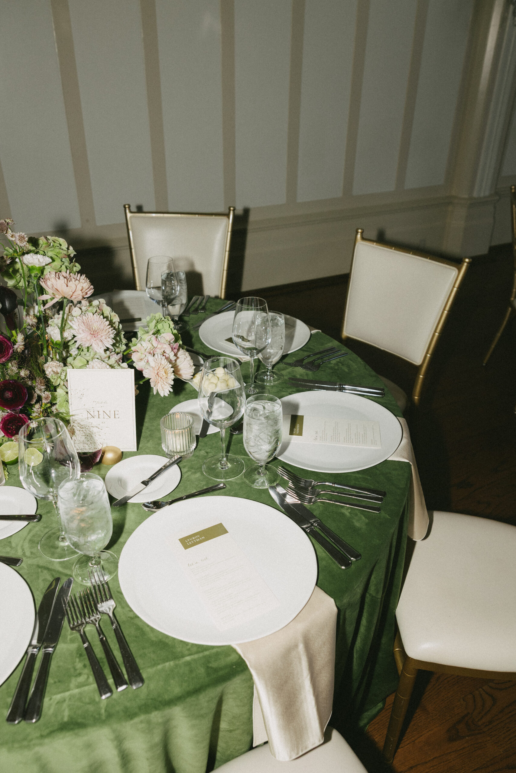 A green wedding table setup for a luxury wedding reception