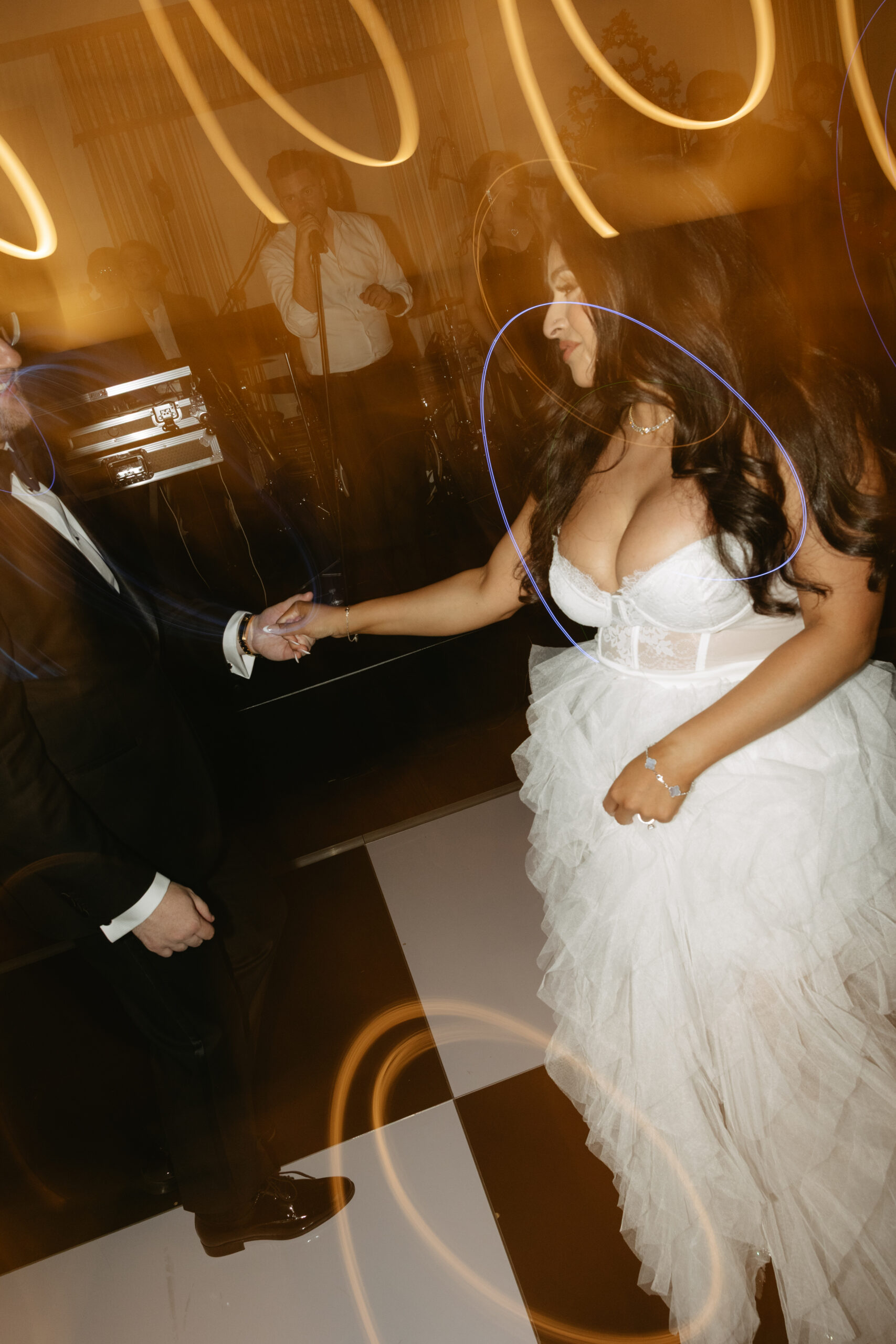 A couple on the dance floor at their wedding reception at Peninsula Golf and COuntry Club