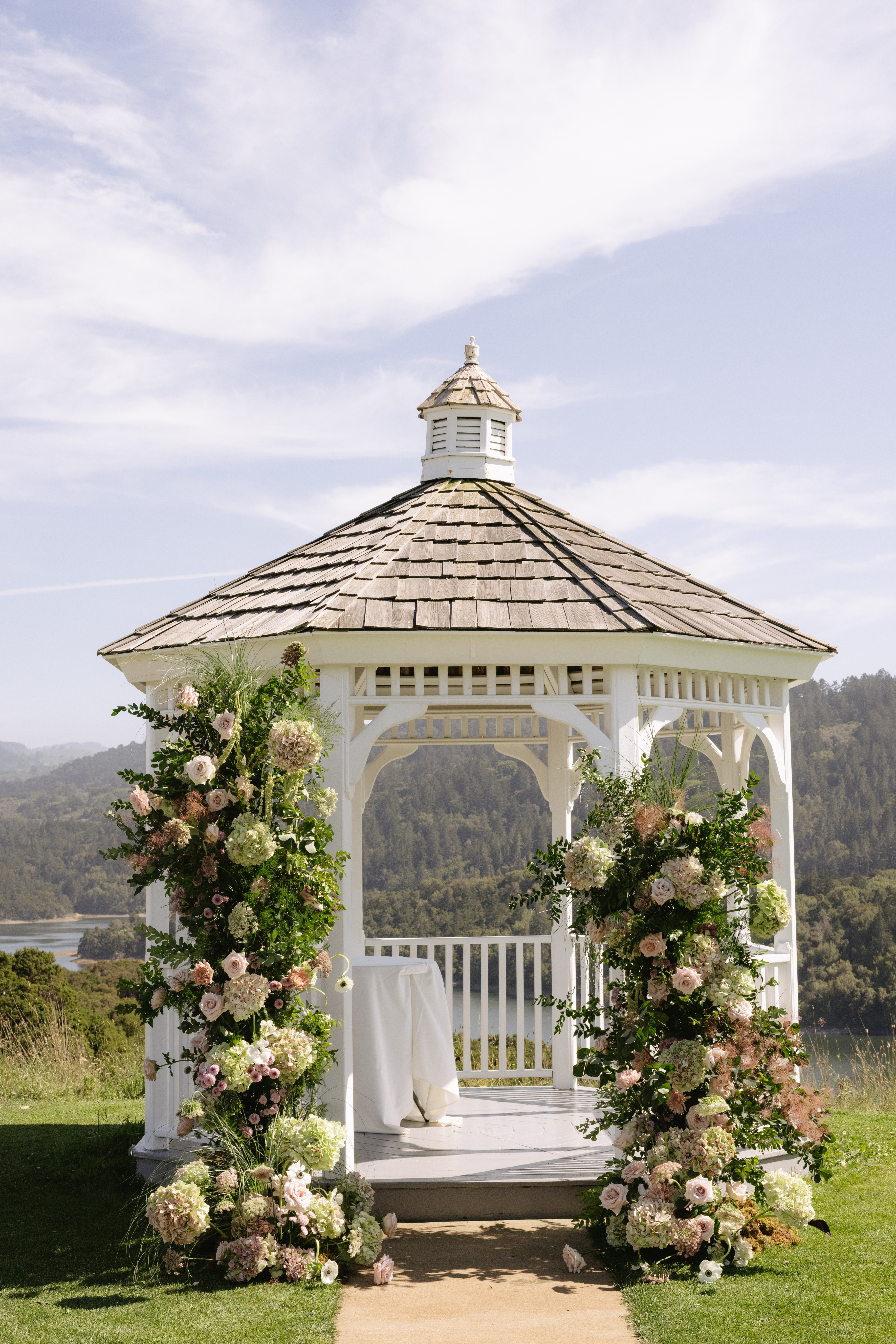 A gazebo set up for an outdoor wedding ceremony